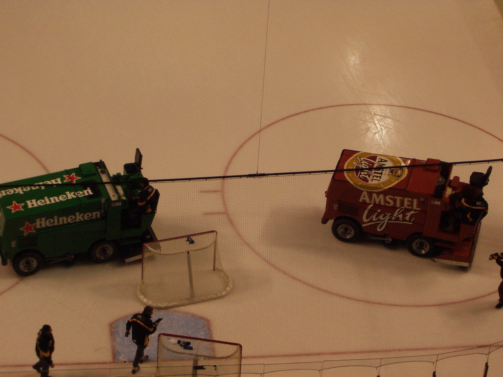 Battling beer zambonis on the Boston Bruins ice surface between periods.