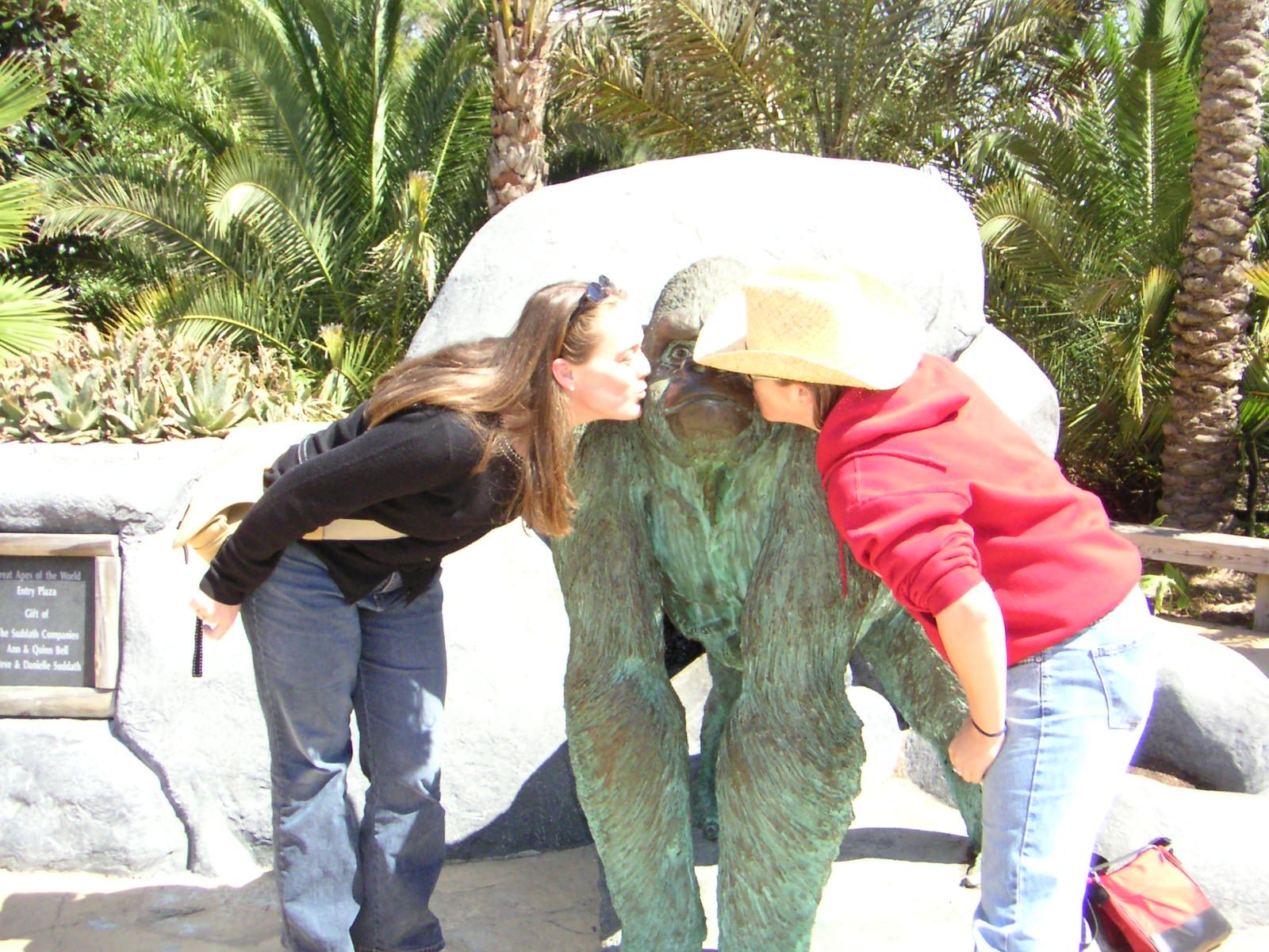 Anna and Catherine kissing a gorilla at the Jacksonville Zoo.