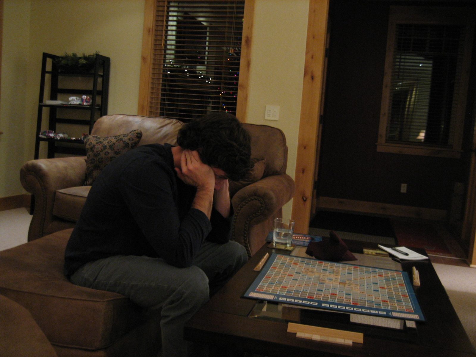 Jay studies his Scrabble tiles in a Christmas Eve game.