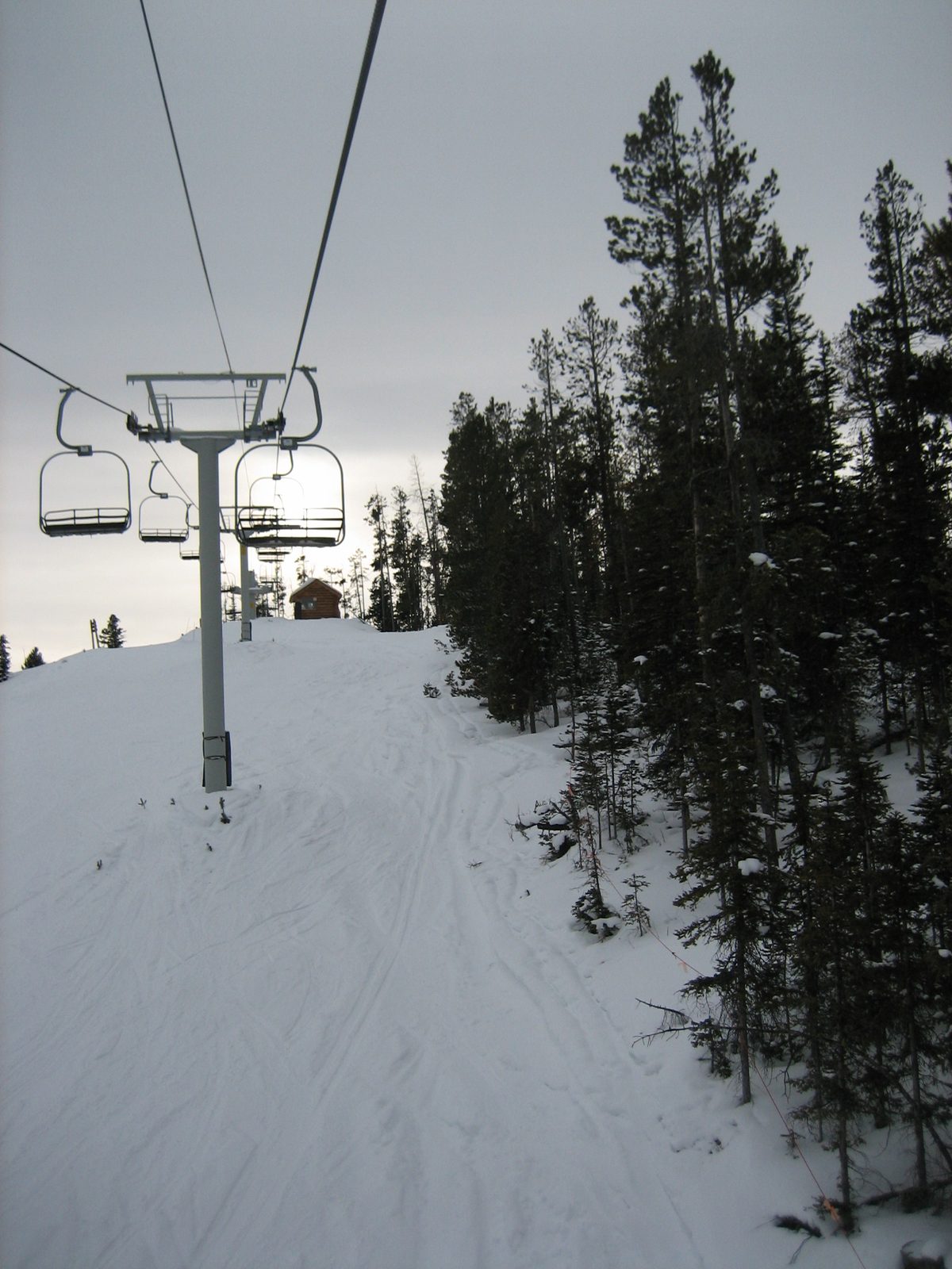Riding the Lone Moose Triple up Flat Iron Mountain near the end of the day.