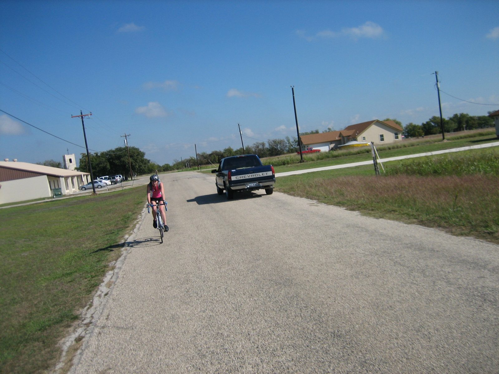 Kate riding down a small country road, as taken by Catherine while riding.  By this point the...