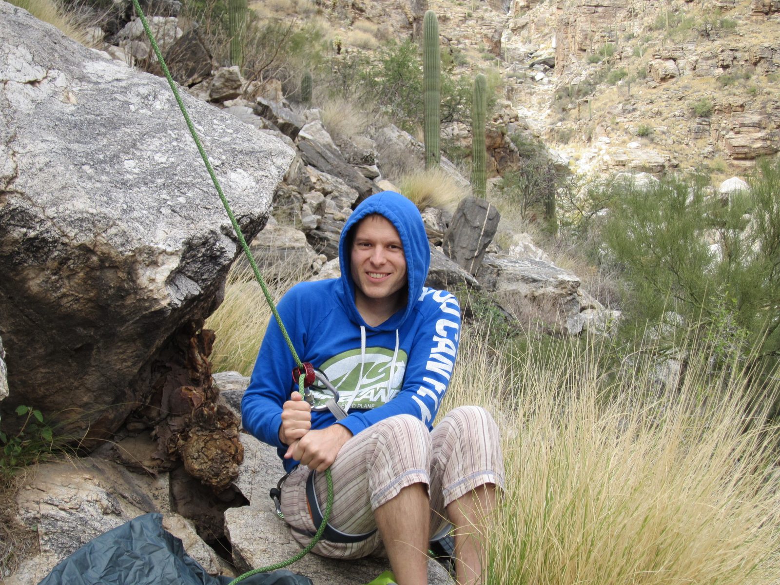John belays in his pjs-turned-climbing pants.