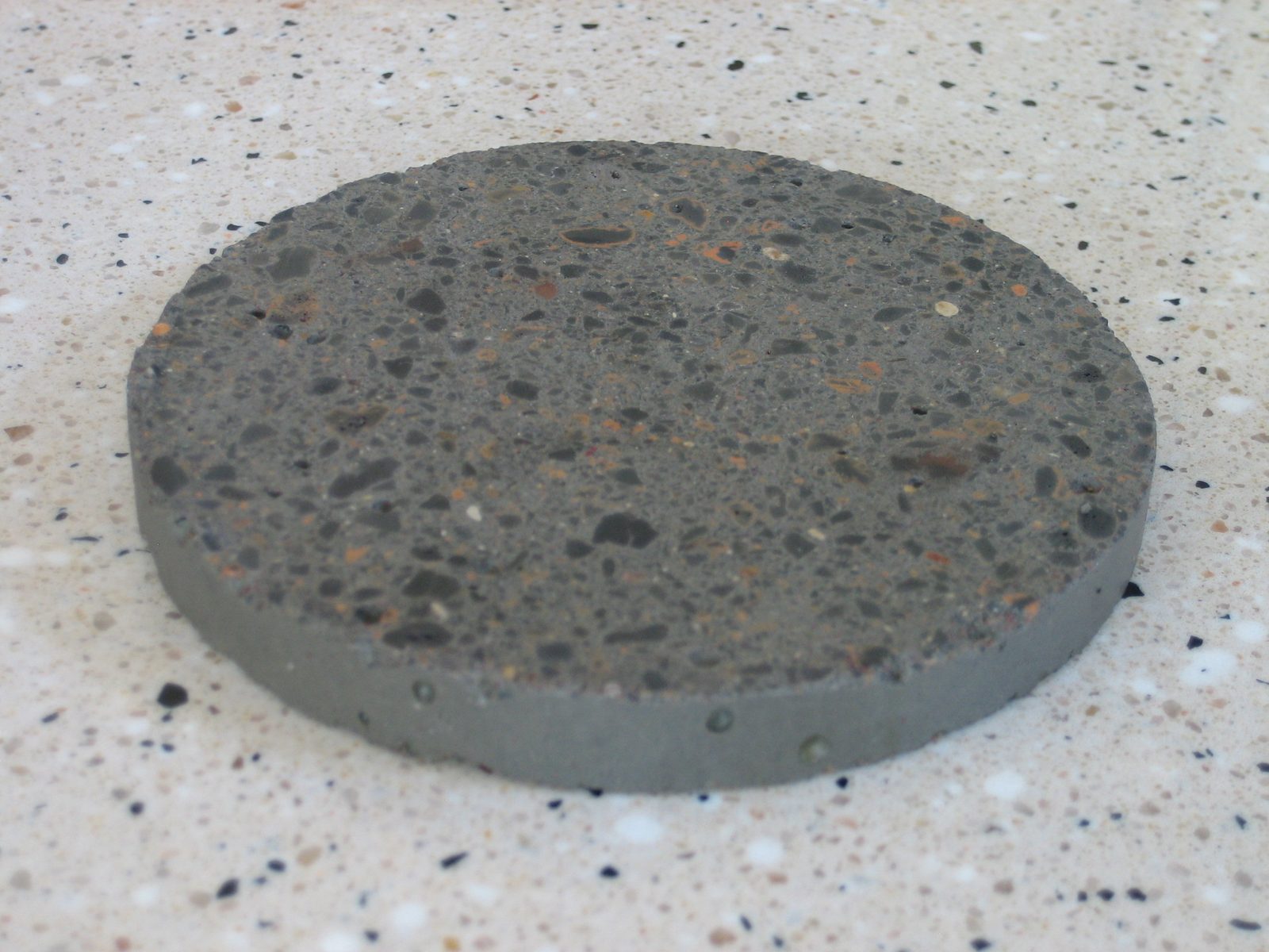 A concrete coaster I made before Christmas and intended to give as a present (with three...