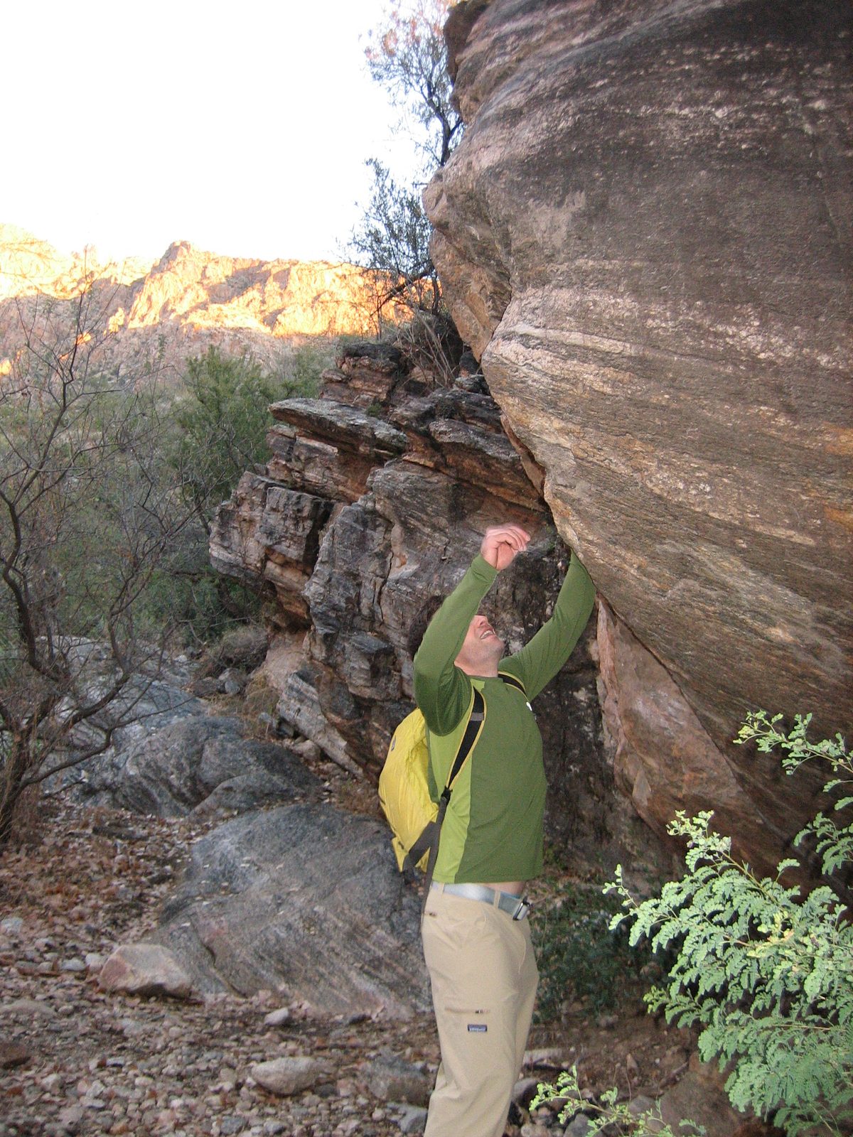 Jay plays on a boulder we found along the trail.