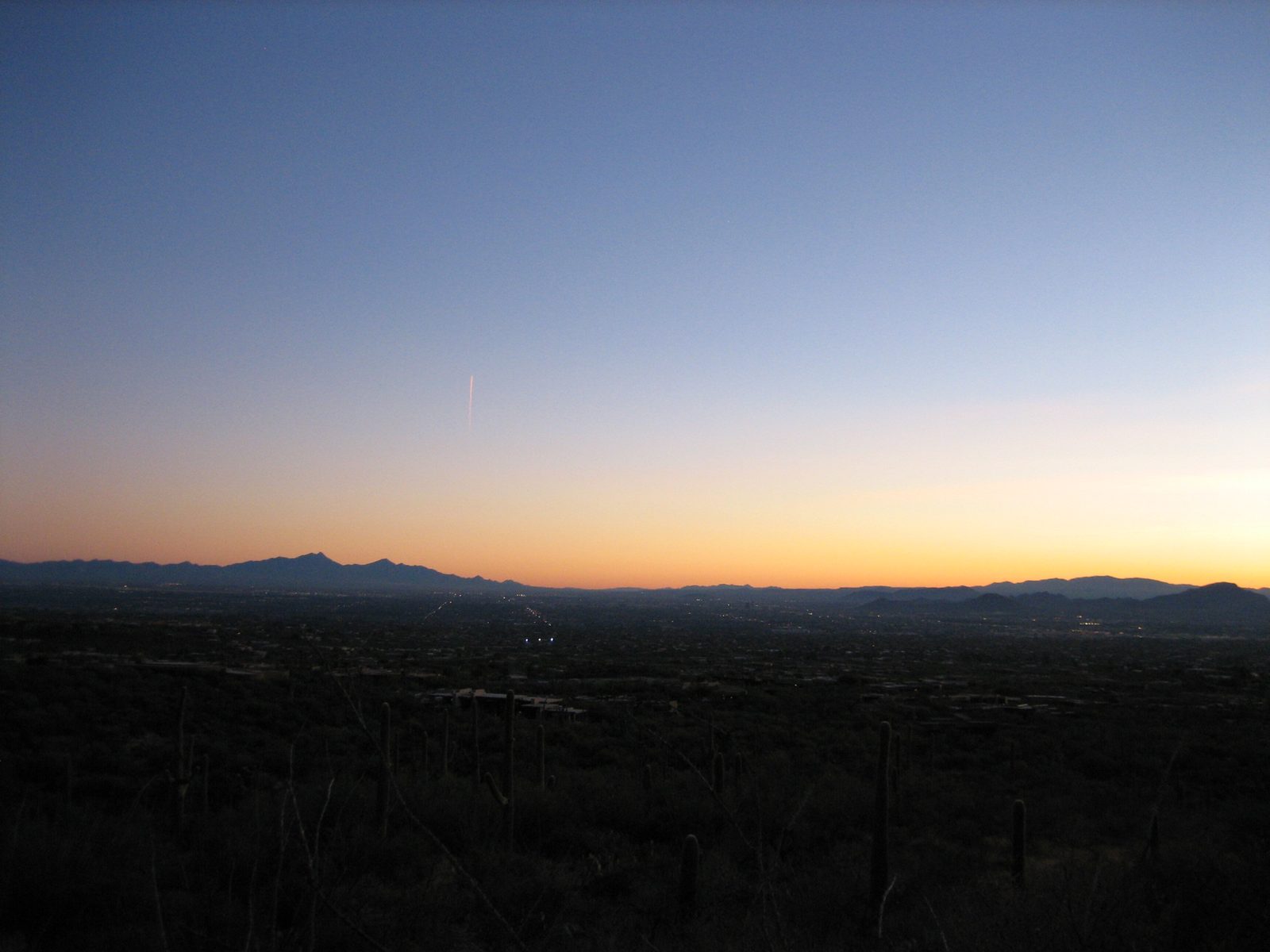 The lights of the city begin to come up, and the major north-south roads are visible.