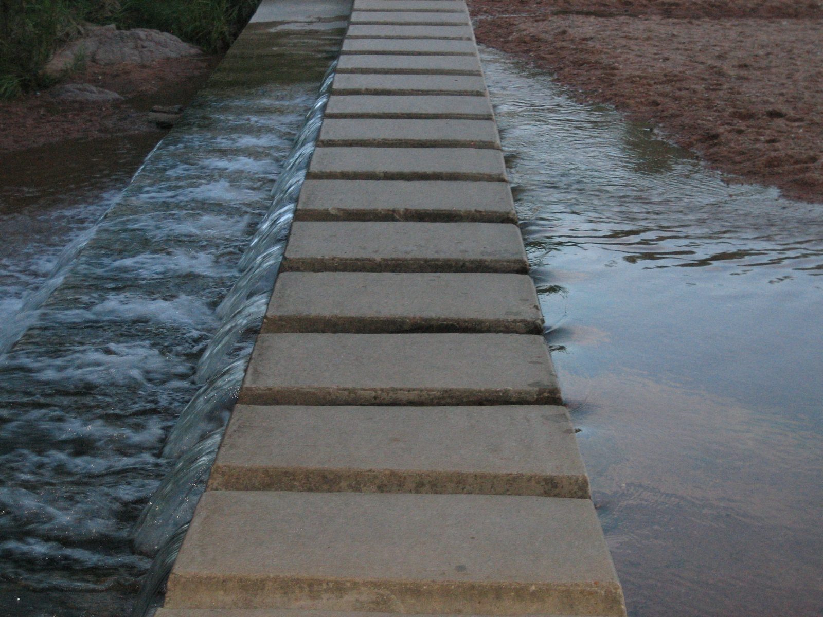 Neat little bridge to the parking lot.  Every time we walk through here (during the sunny hours,...