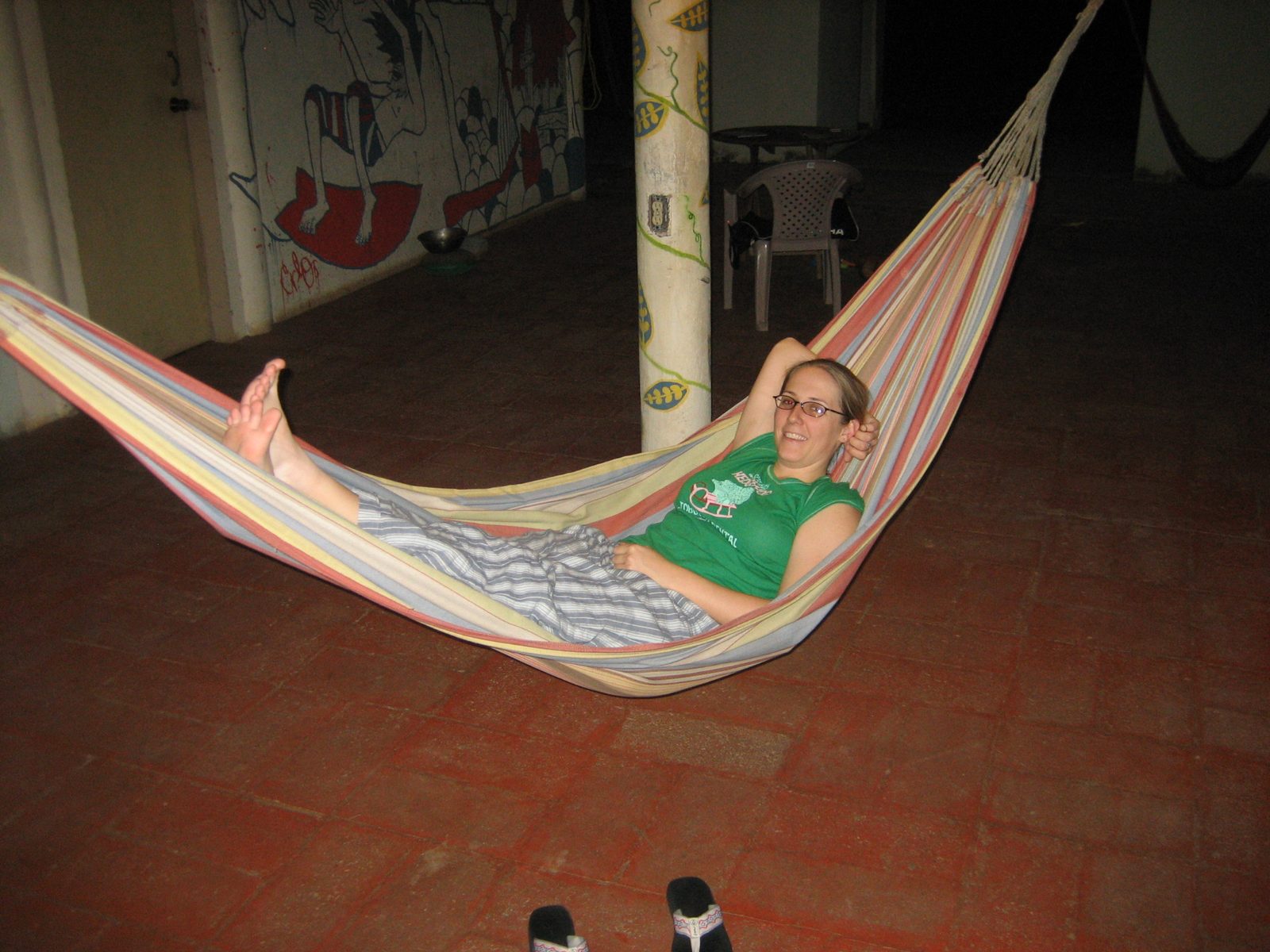 Relaxing in a hammock at El Hostel in Playa El Sunzal.  As a guy we met at a future hostel put...