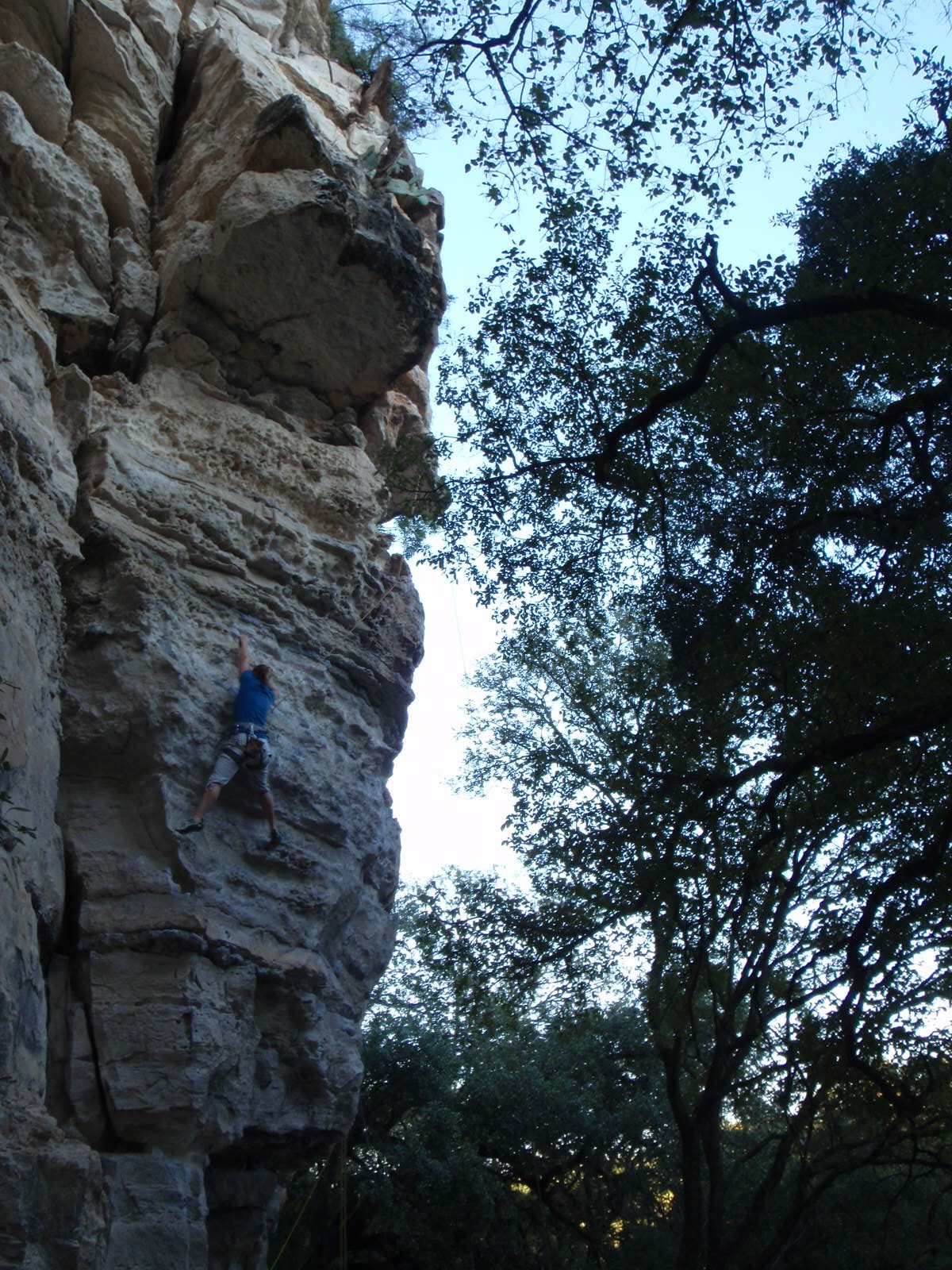 Reaching for the next hold.