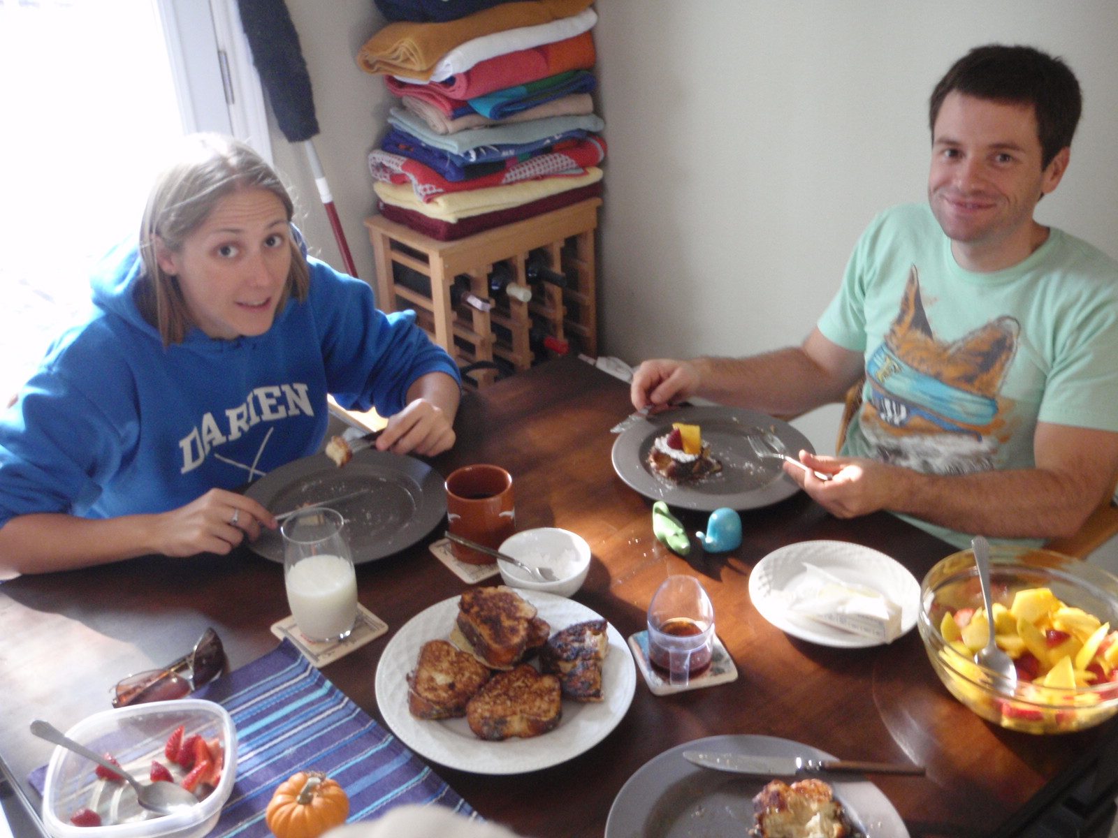 Jay with his mouth full; Catherine with an empty plate.