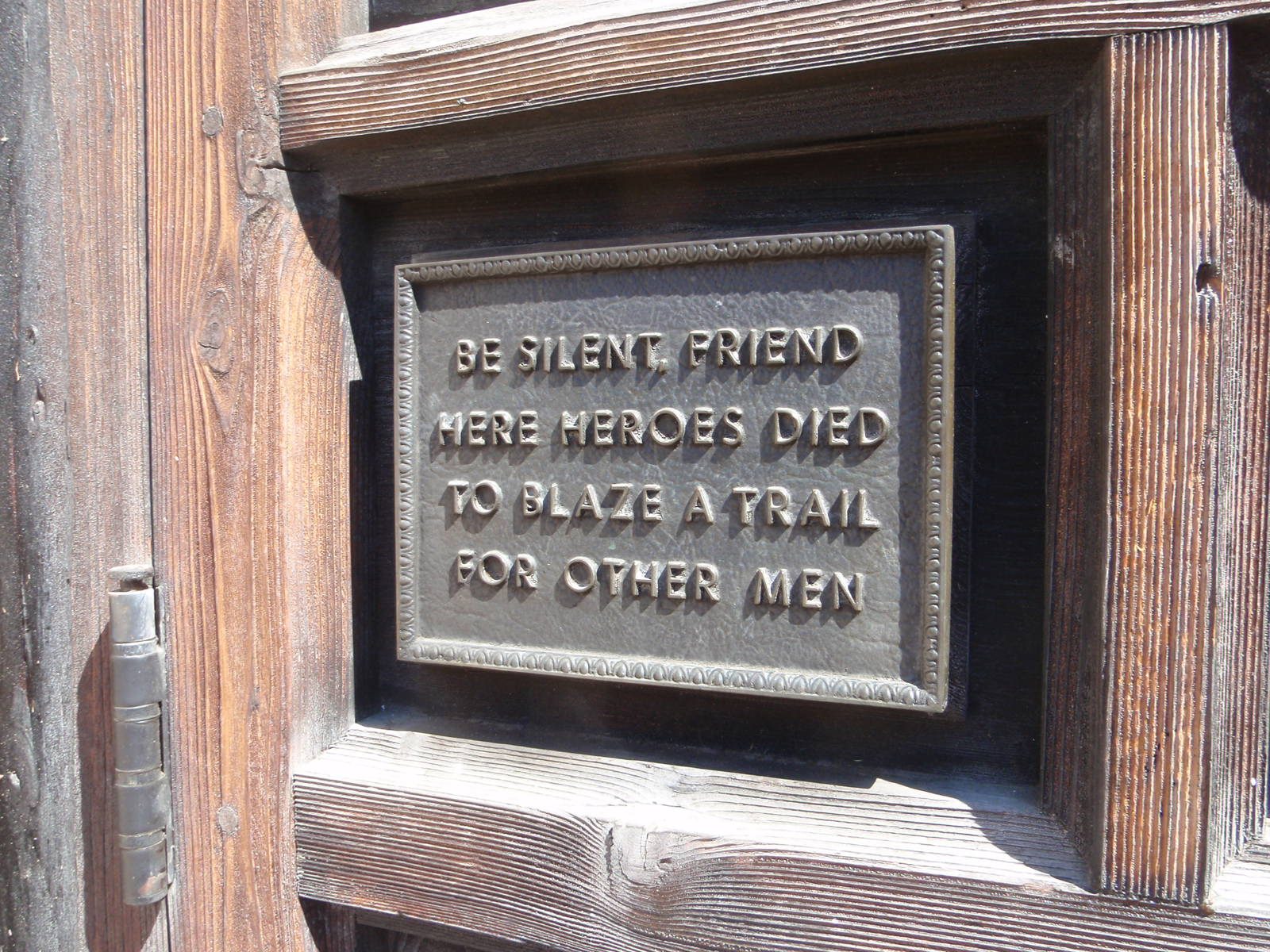 A plaque outside the Alamo.