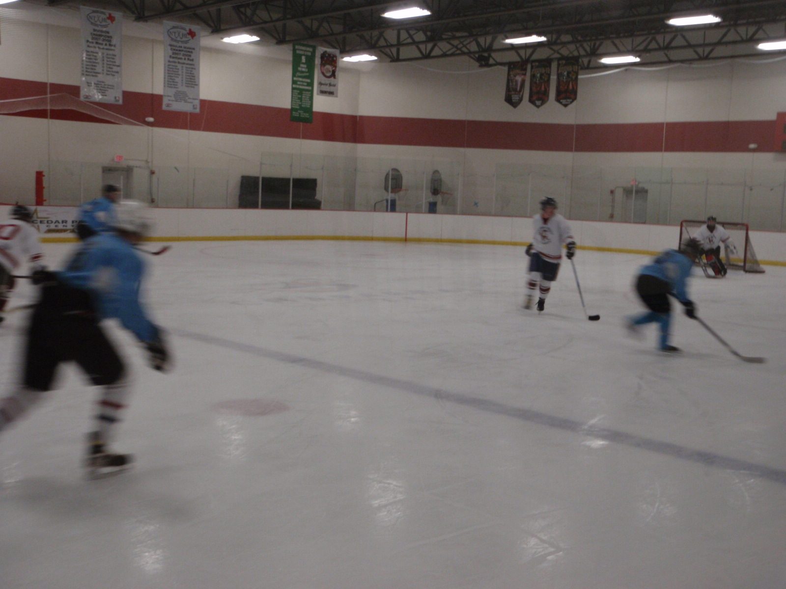 Skating in on goal with the puck.