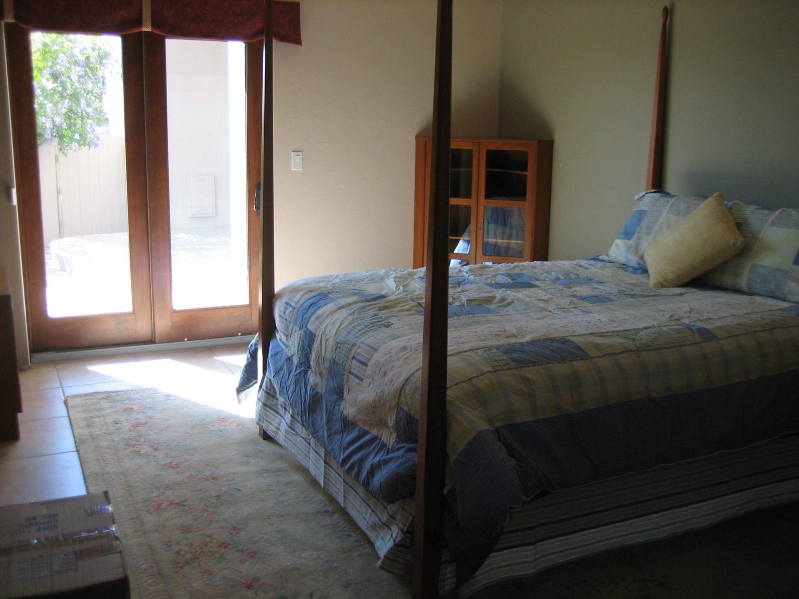Bedroom set up with furniture from Catherine's room.  The doors go out to a small patio with astroturf!