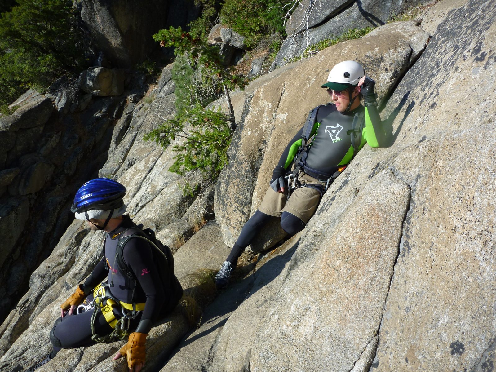 Tommer and Jon watch Monica rappel.