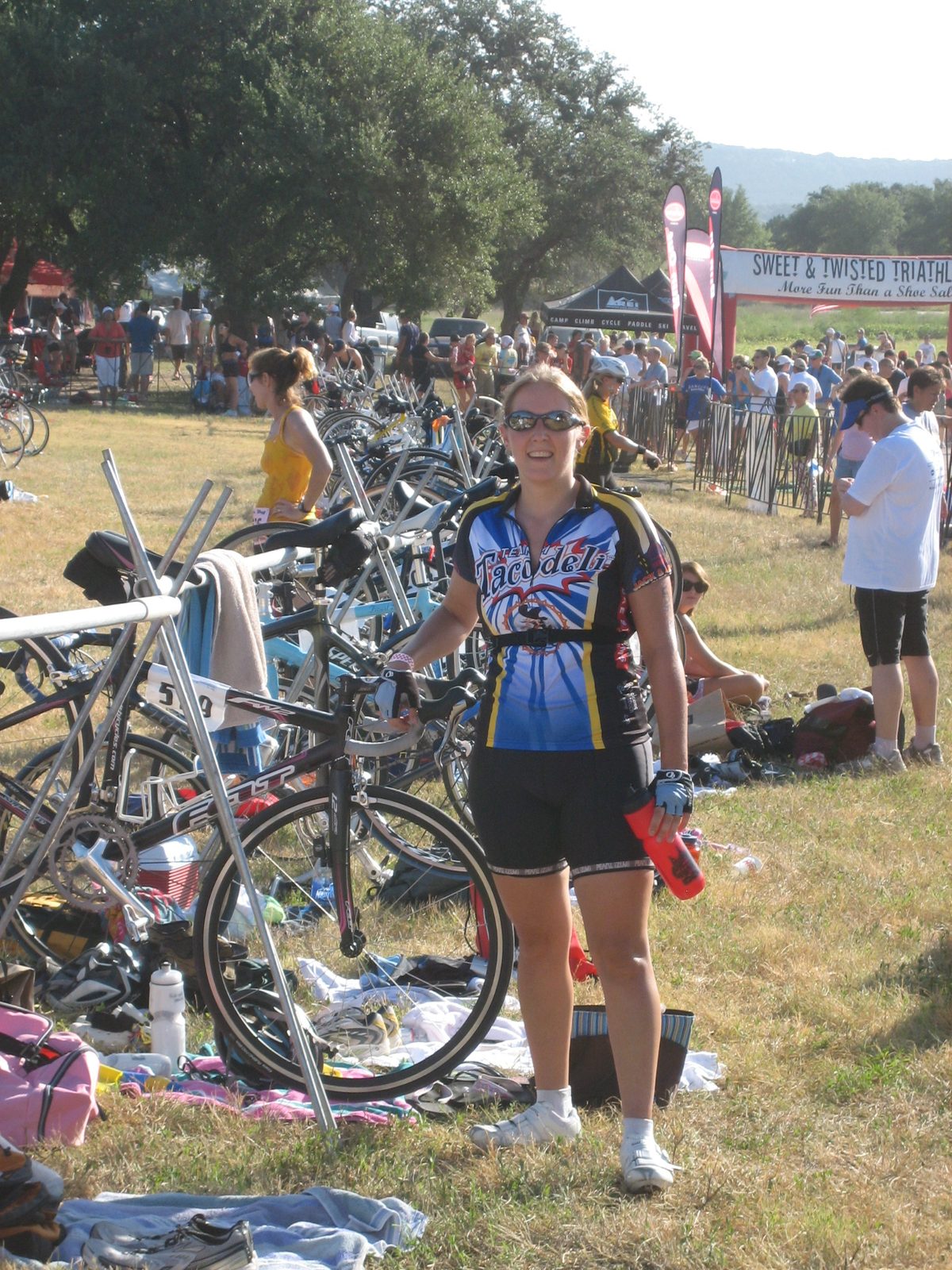 Standing by my bike.  Oh no! I'm still wearing the team race belt with number!  About this...