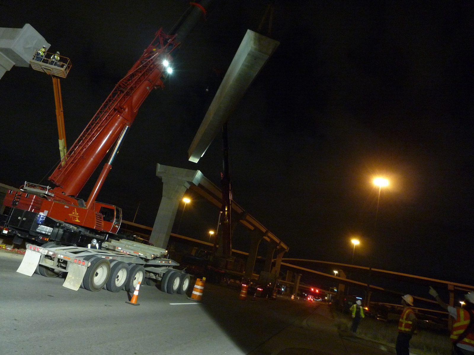 Higher it goes.  Note that there is an open lane of traffic between the TxDOT workers (in orange...