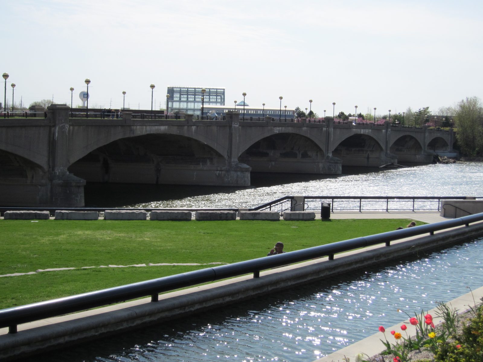 What looks like an old car bridge, transformed into a pedestrian bridge (with grass and sidewalk...