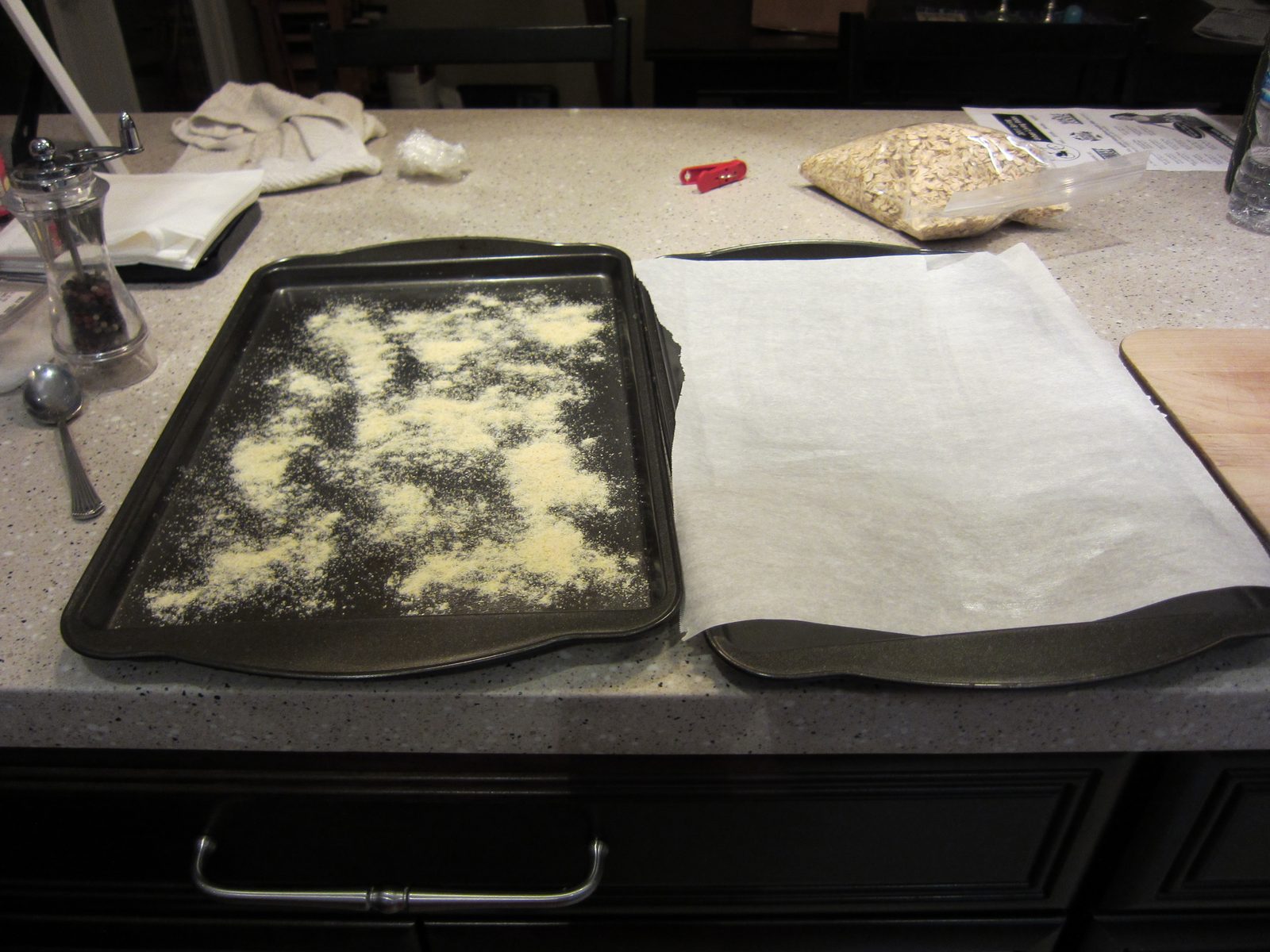 One tray prepared with cornmeal, one without.