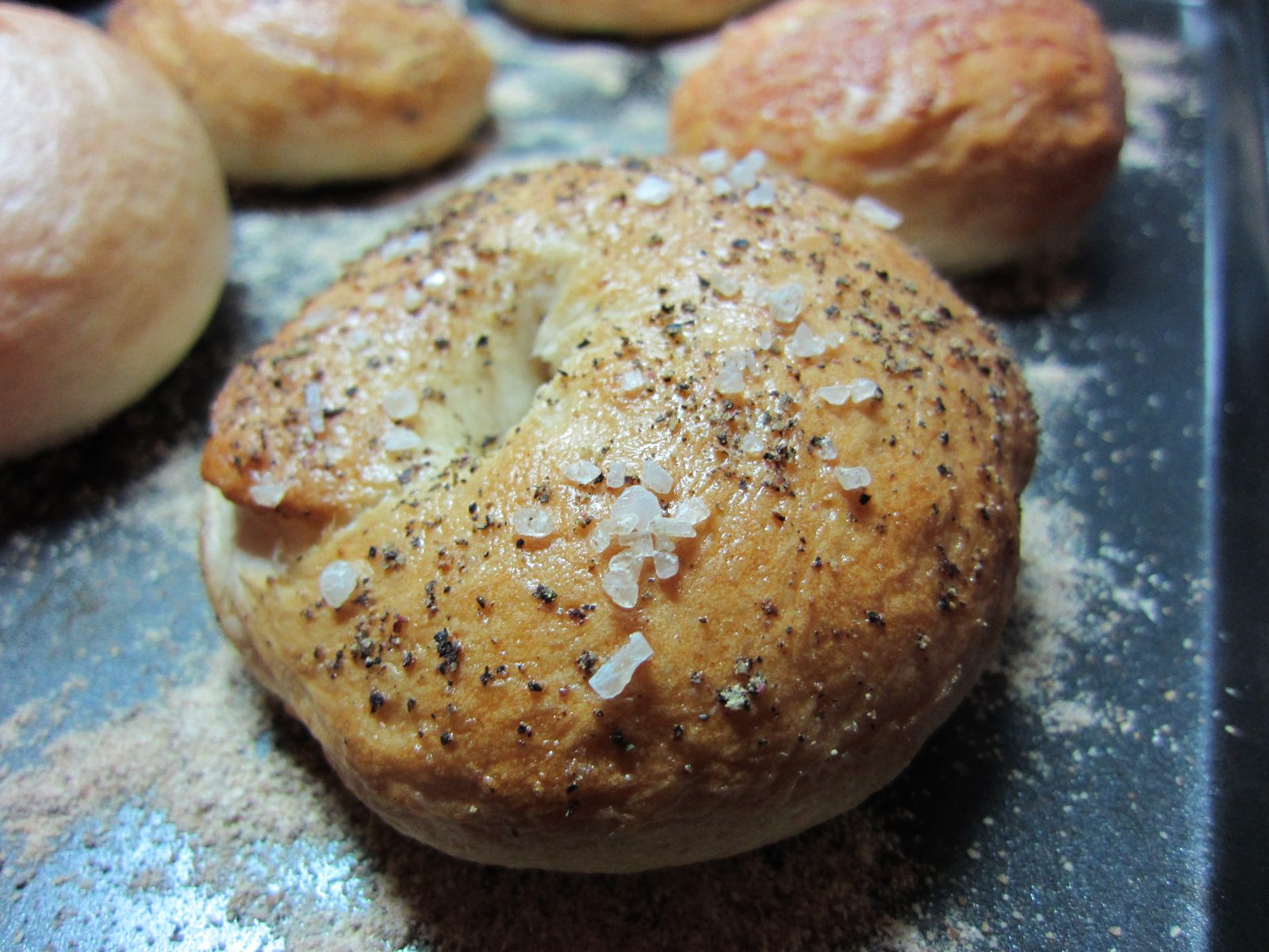 Close-up of one of the salt-and-pepper bagels.