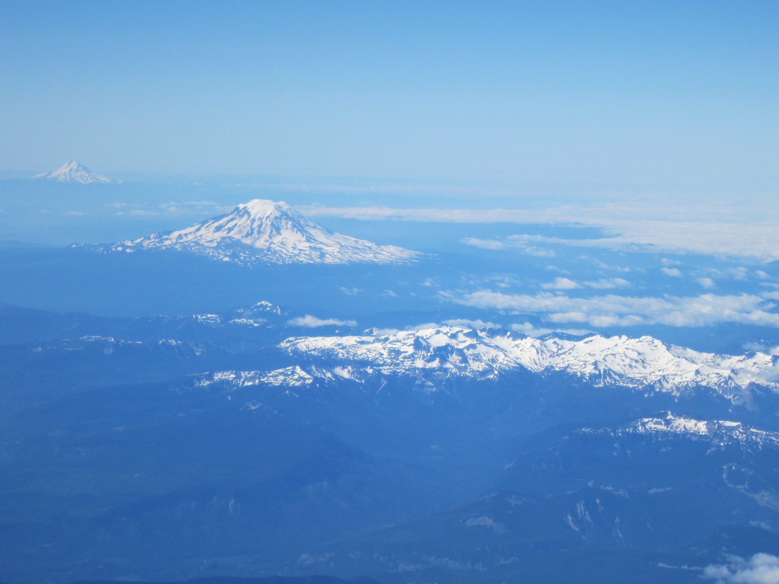 Flying in to SEA in early August.  I believe Mt. Adams is the most prominent peak in this picture.