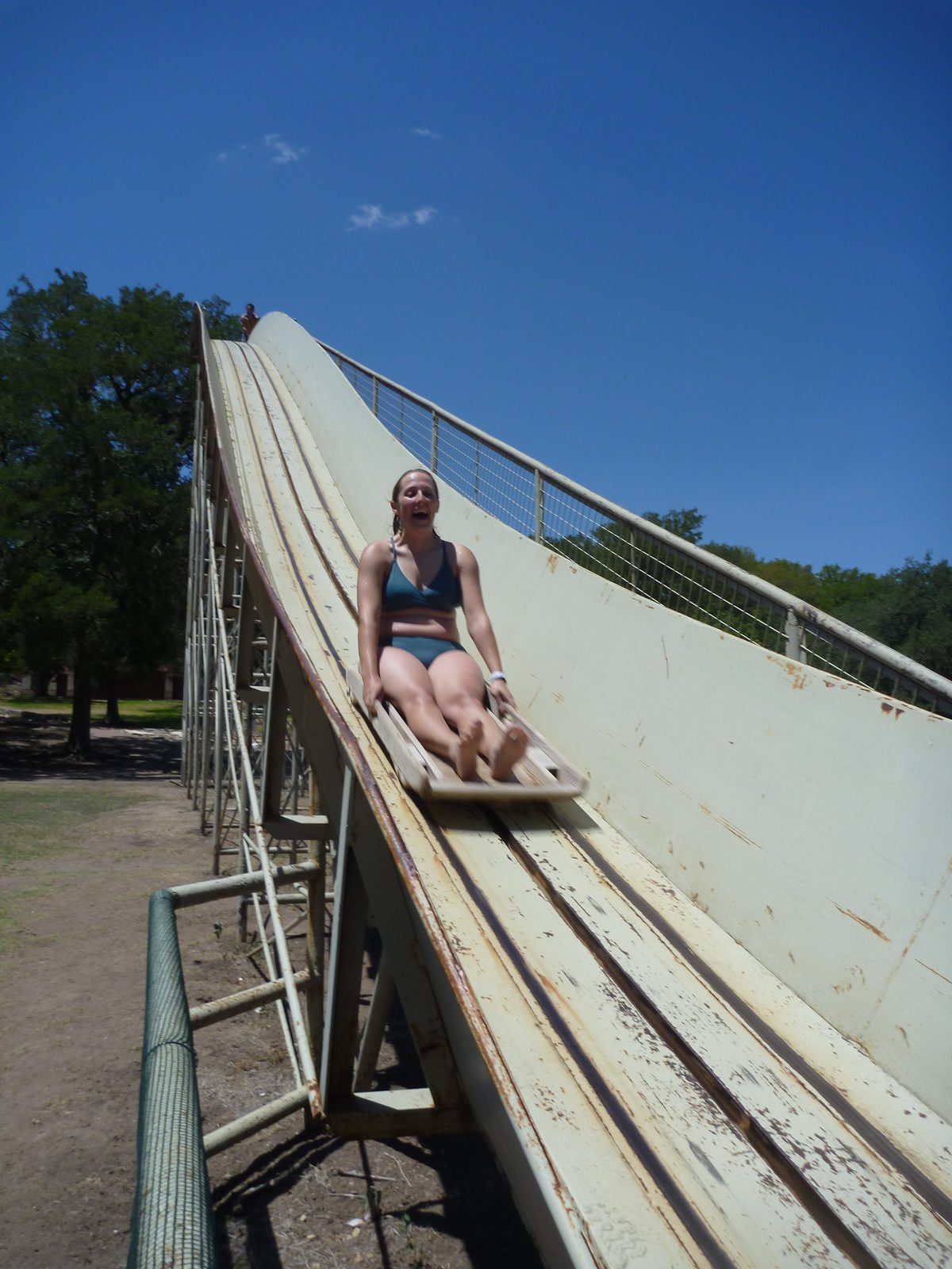 Going down a crazy slide into the water at Mo-Ranch.