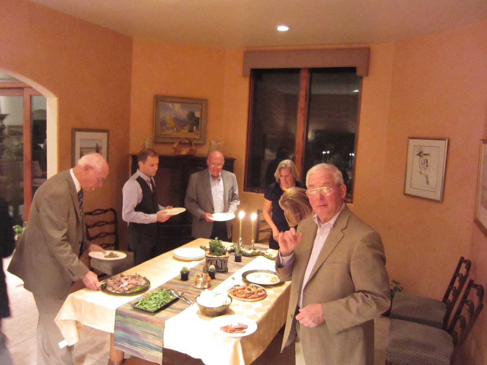 Everyone loads up.  Dinner included lamb, green beans in an herb butter, roasted tomato halves,...