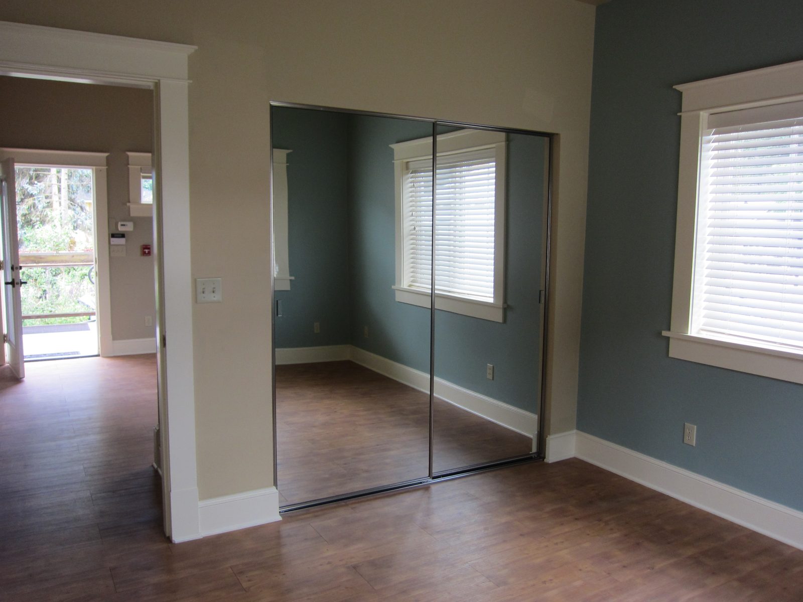 Closet of the front bedroom, and the front door.