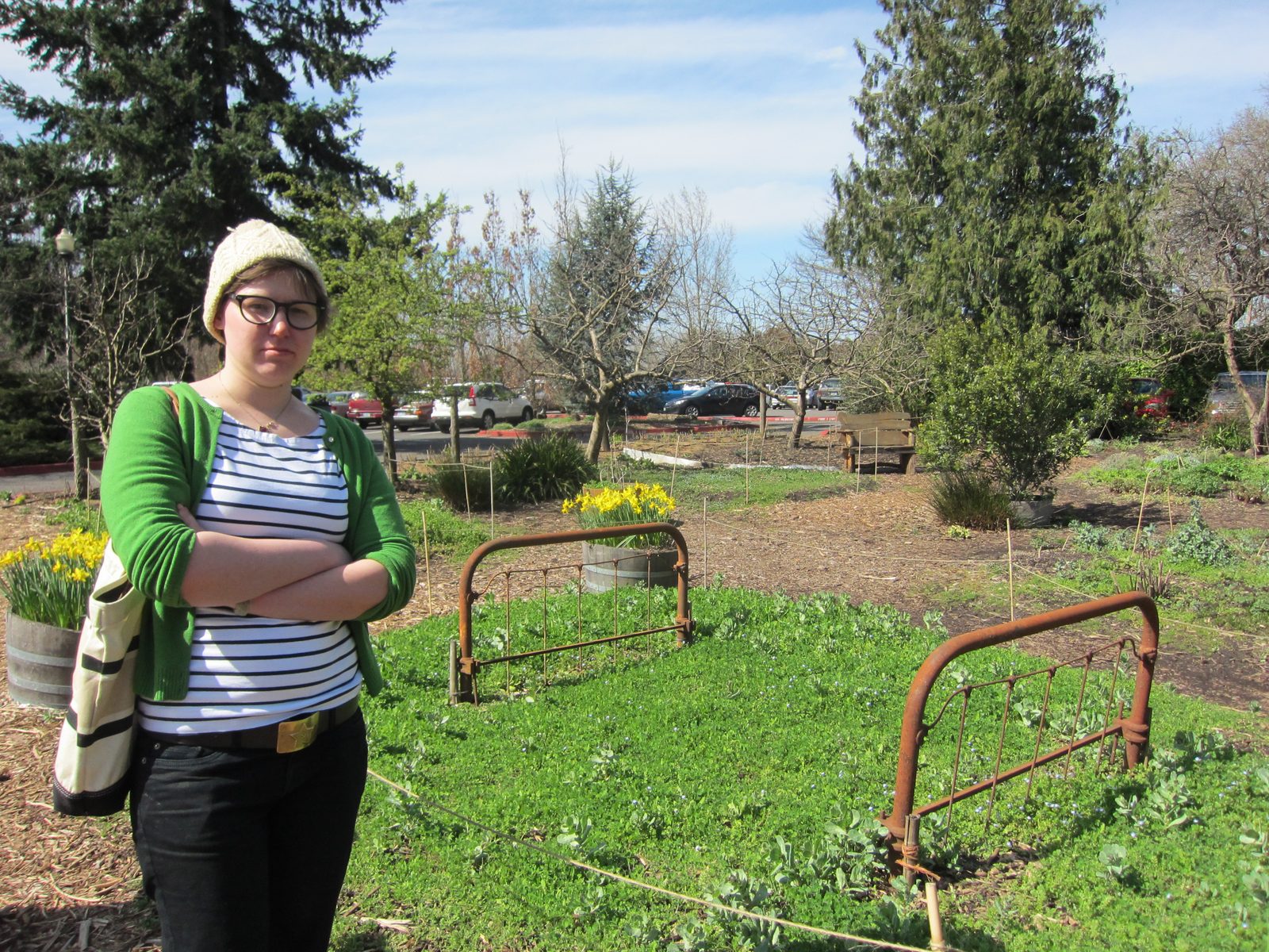 After lunch, Emily checks out the bed in the flower bed.
