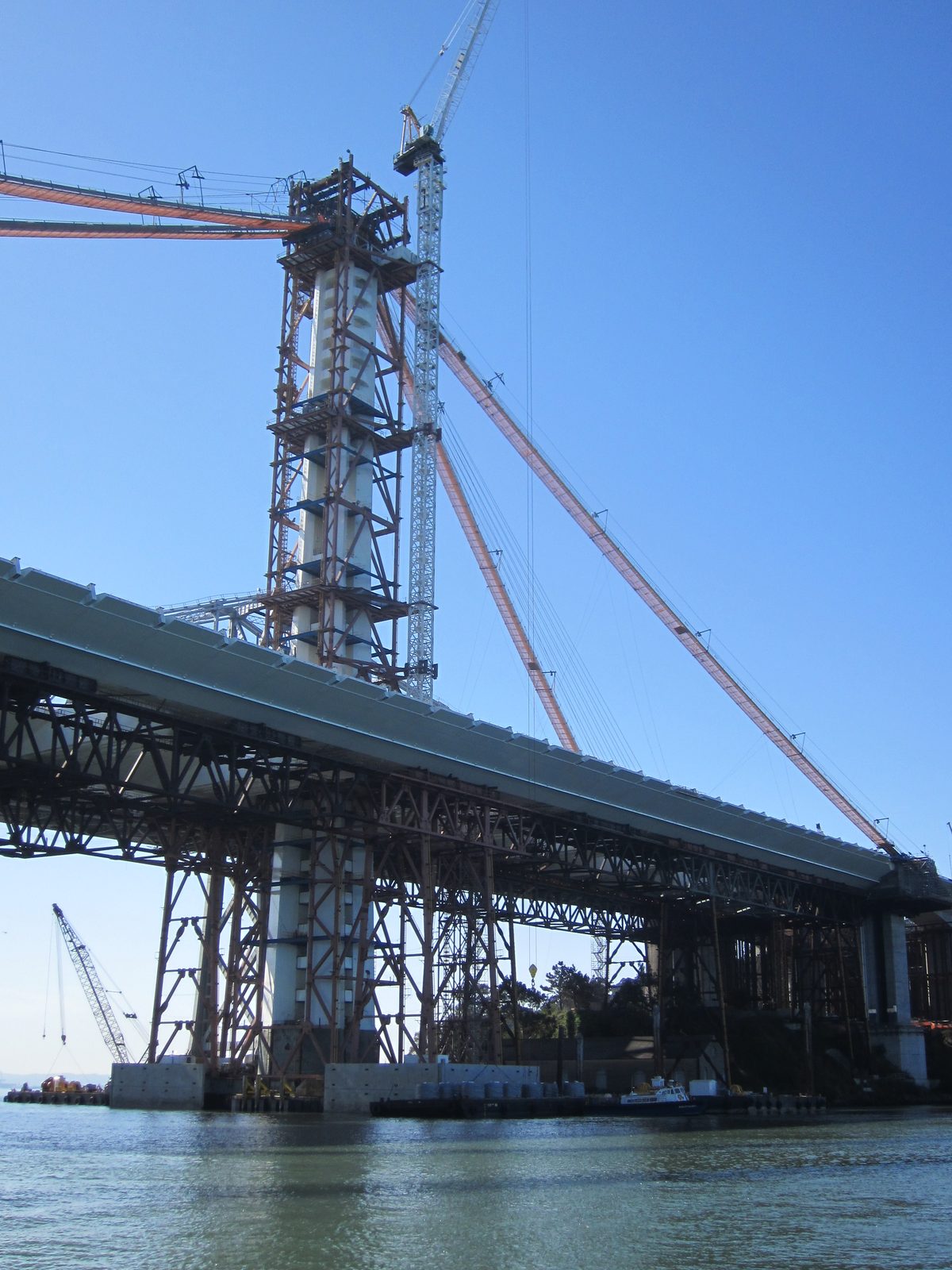 Looking up at the SAS tower.  Eventually, when the big cable is complete, the bridge deck will...