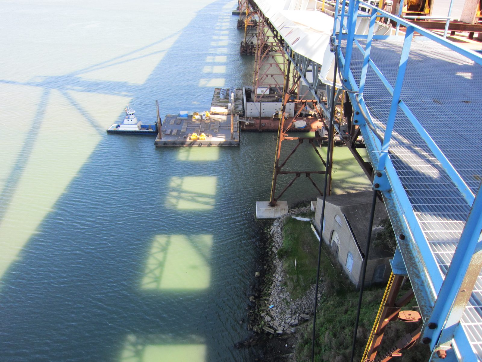 The tower shadow on the water so very far below.