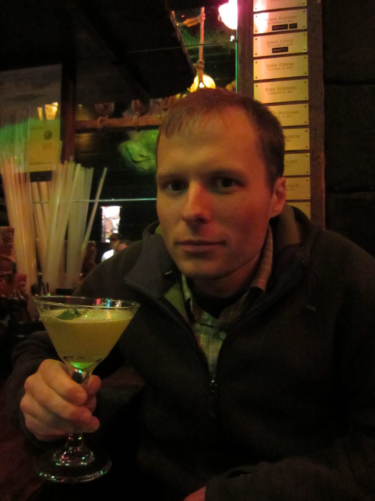John with his drink (hot buttered rum) at Smuggler's Cove bar in San Francisco.