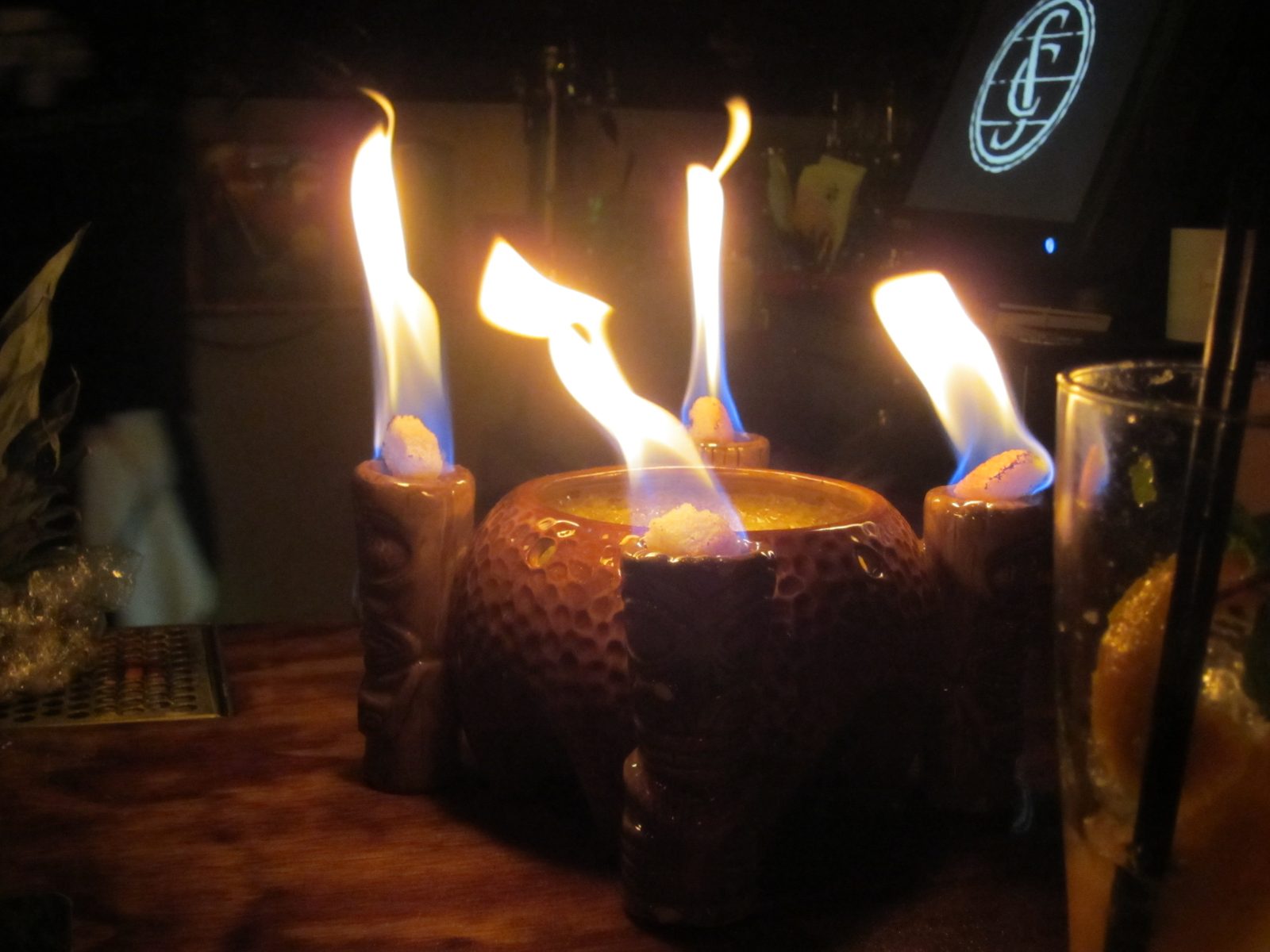 Our flaming volcano drink at Smuggler's Cove.  The blobs on fire are pieces of bread soaked in...