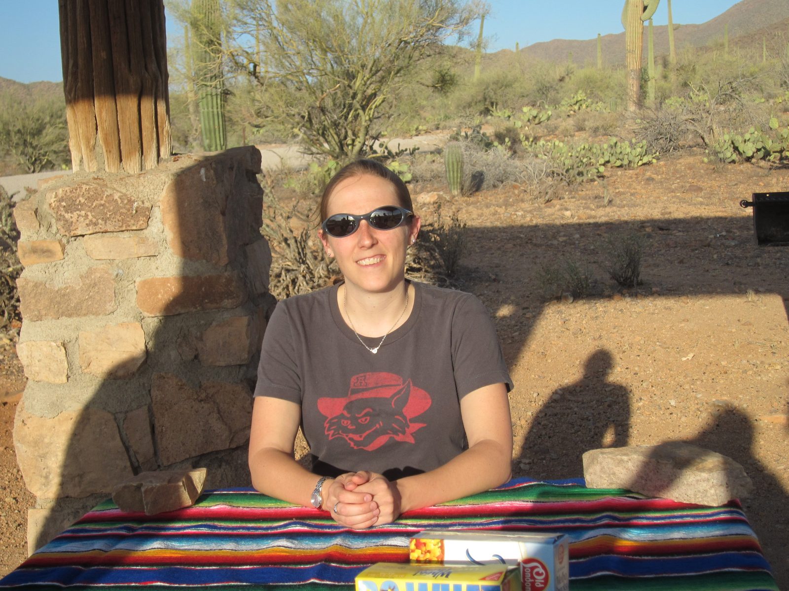 Catherine at the table (note the big rocks).  It would have been rather warm except for the great breeze.