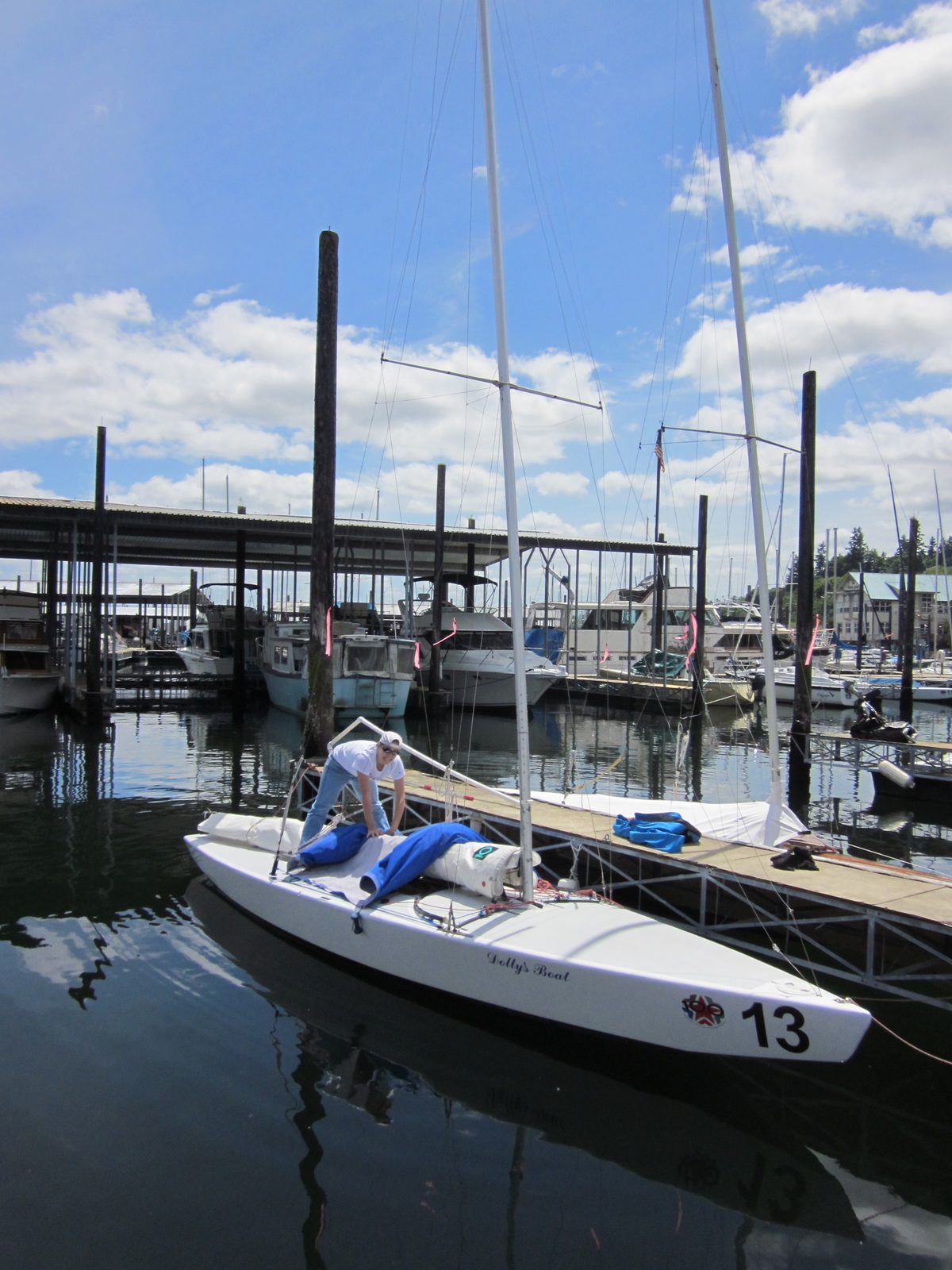 What a beautiful day to go sailing!  Getting the cover off the boat...