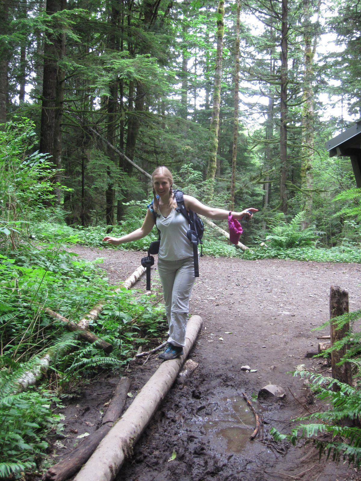 Diana navigates some mud at the trailhead.