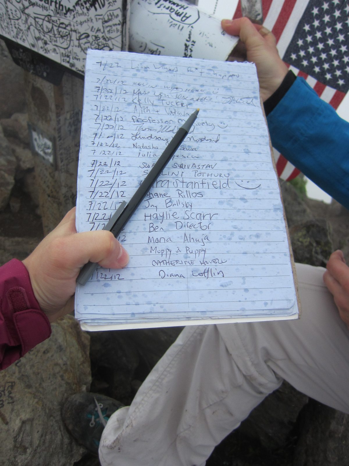 Our names are proof we were there!  Note, however, the raindrops on the paper :(