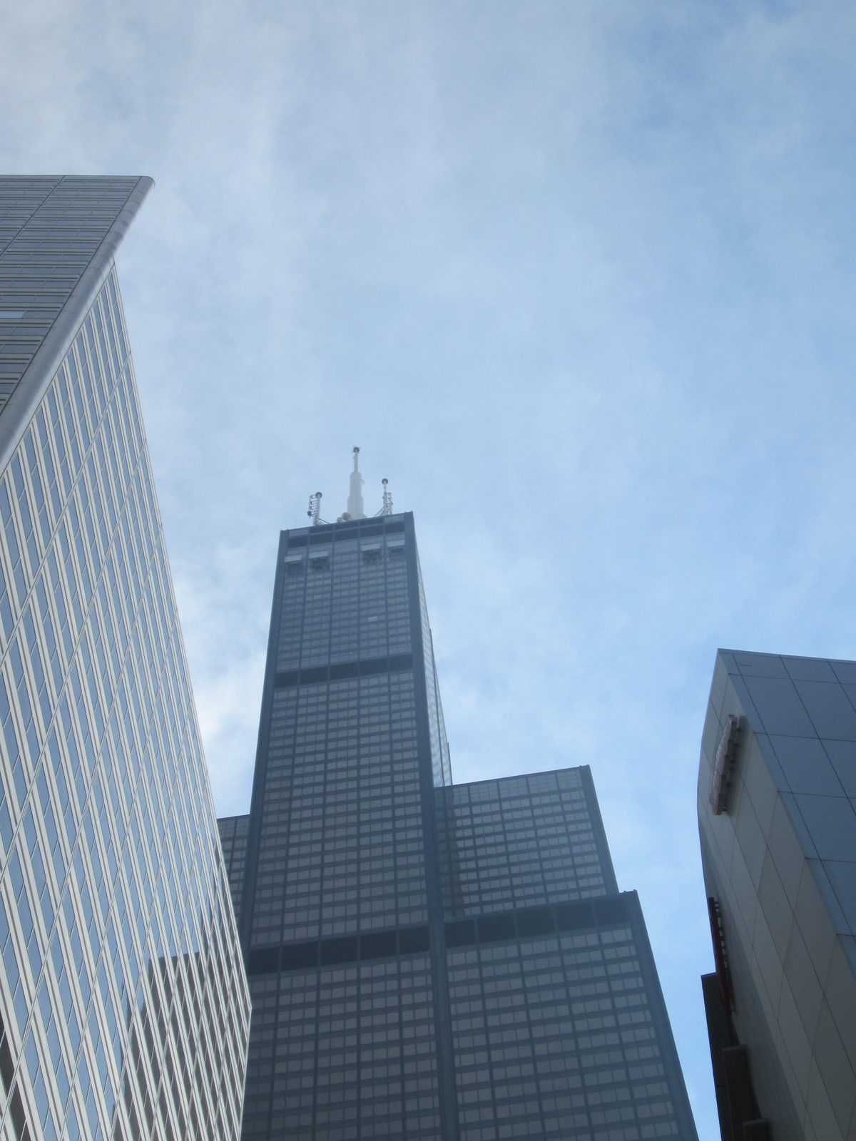 Looking up at the observation decks near the top of the Sears Tower.  If you look close, you can...