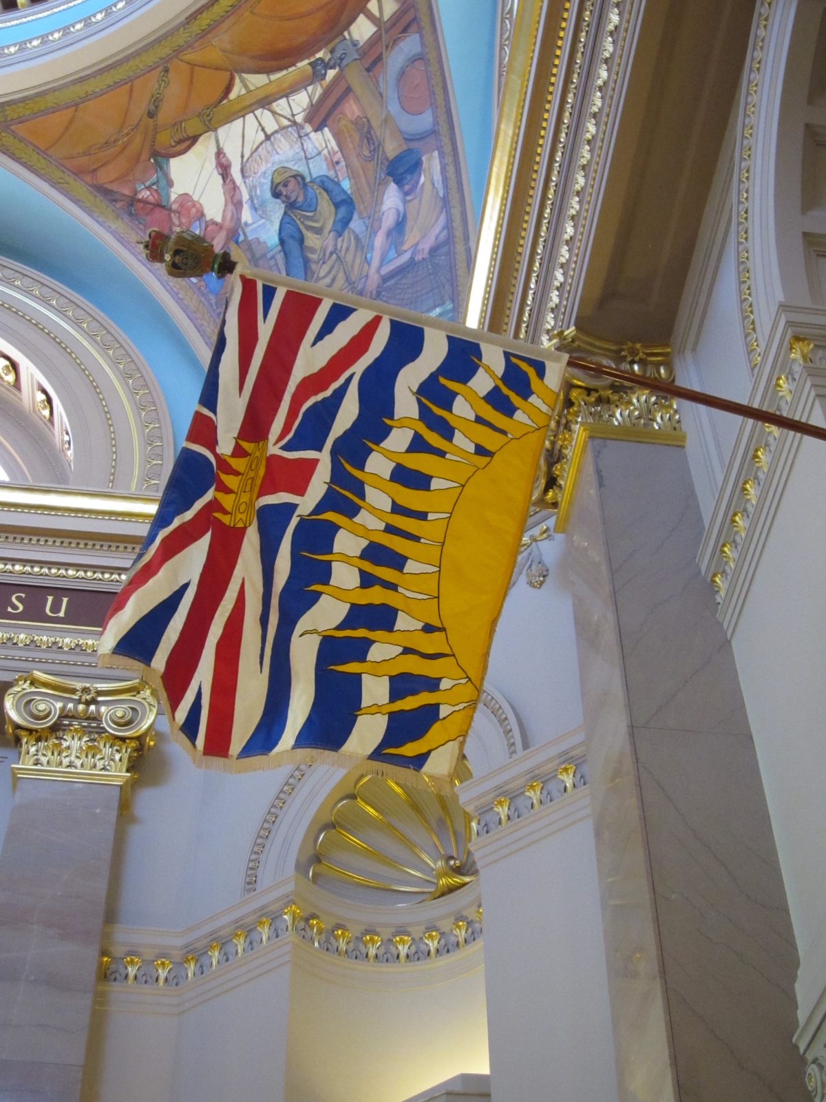 The flag of British Columbia. From wikipedia: The four wavy white and three wavy blue lines...