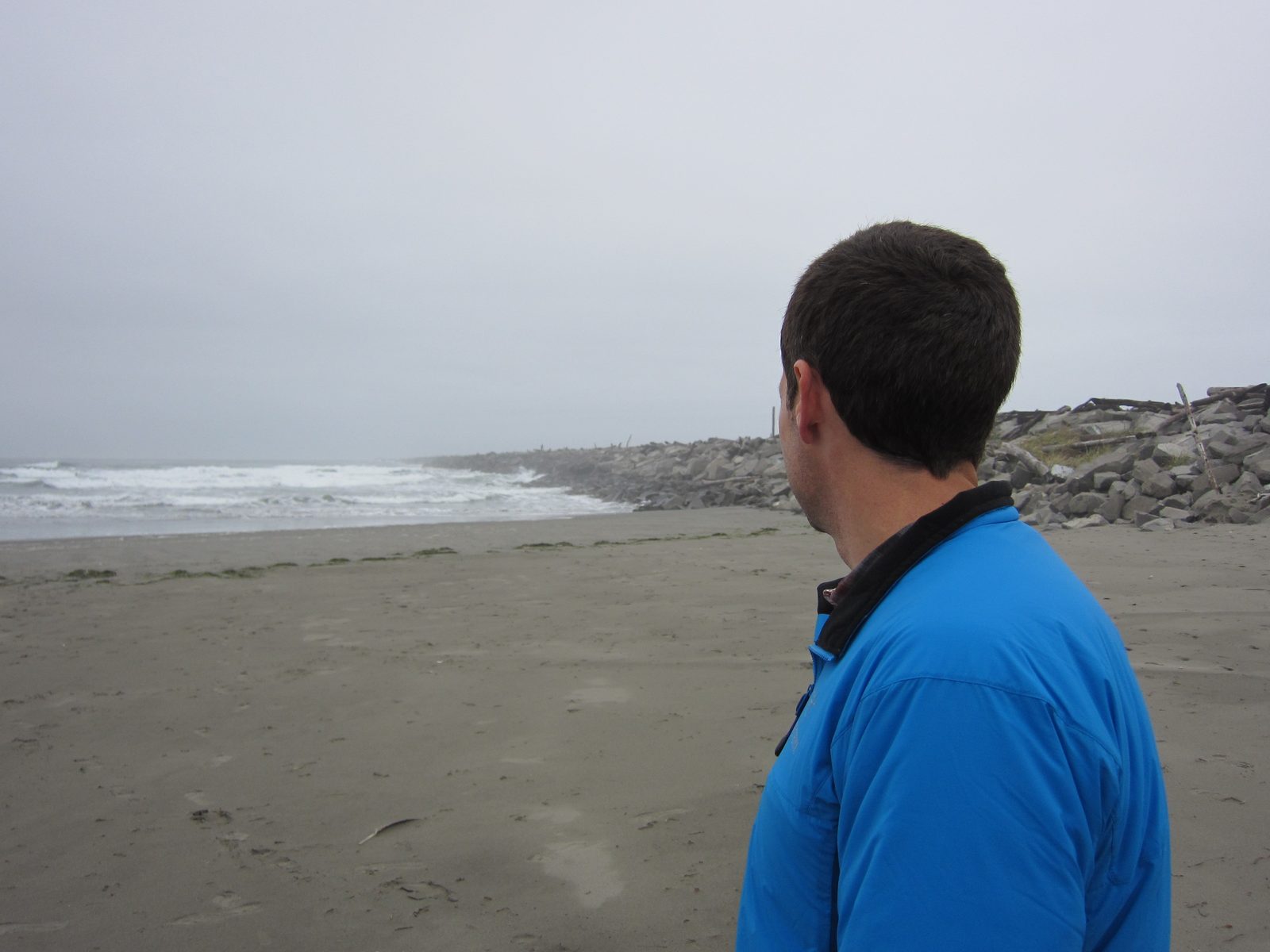 Jay looks down the jetty in Westport, WA.
