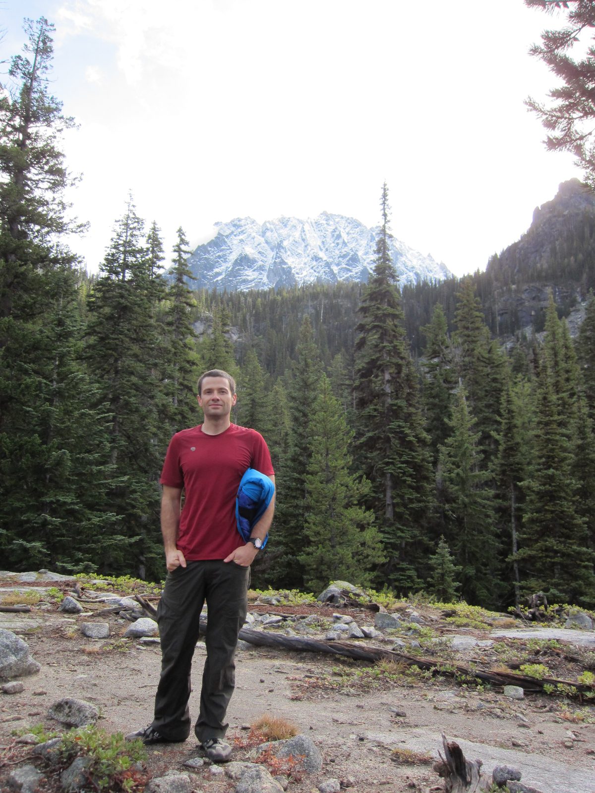 Jay in front of the snow-capped peak.  A mountaineer can get to the top through more than 20...
