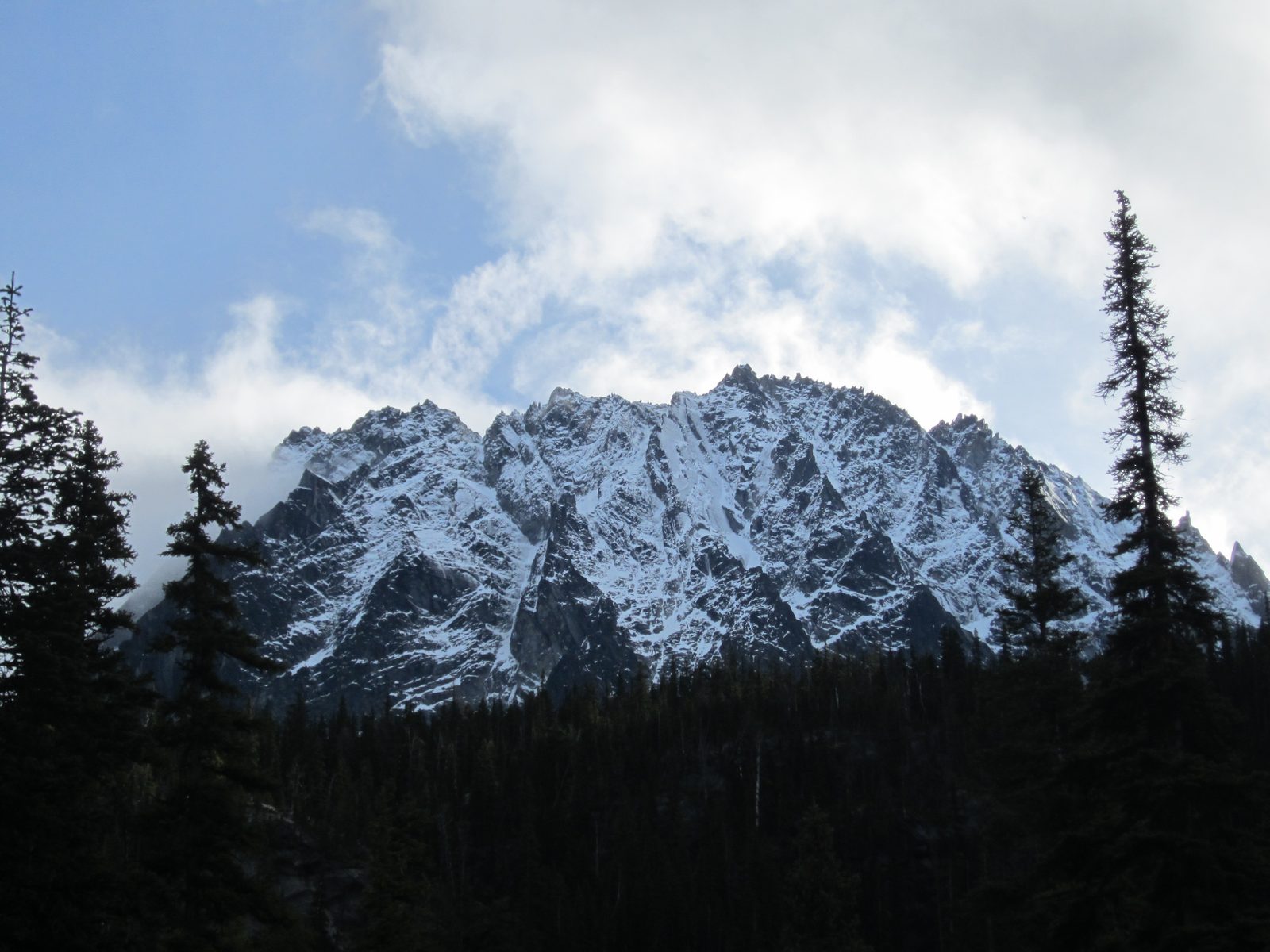 The mountain was named in 1955 after some climbers declared that it looked like a dragon tail. ...