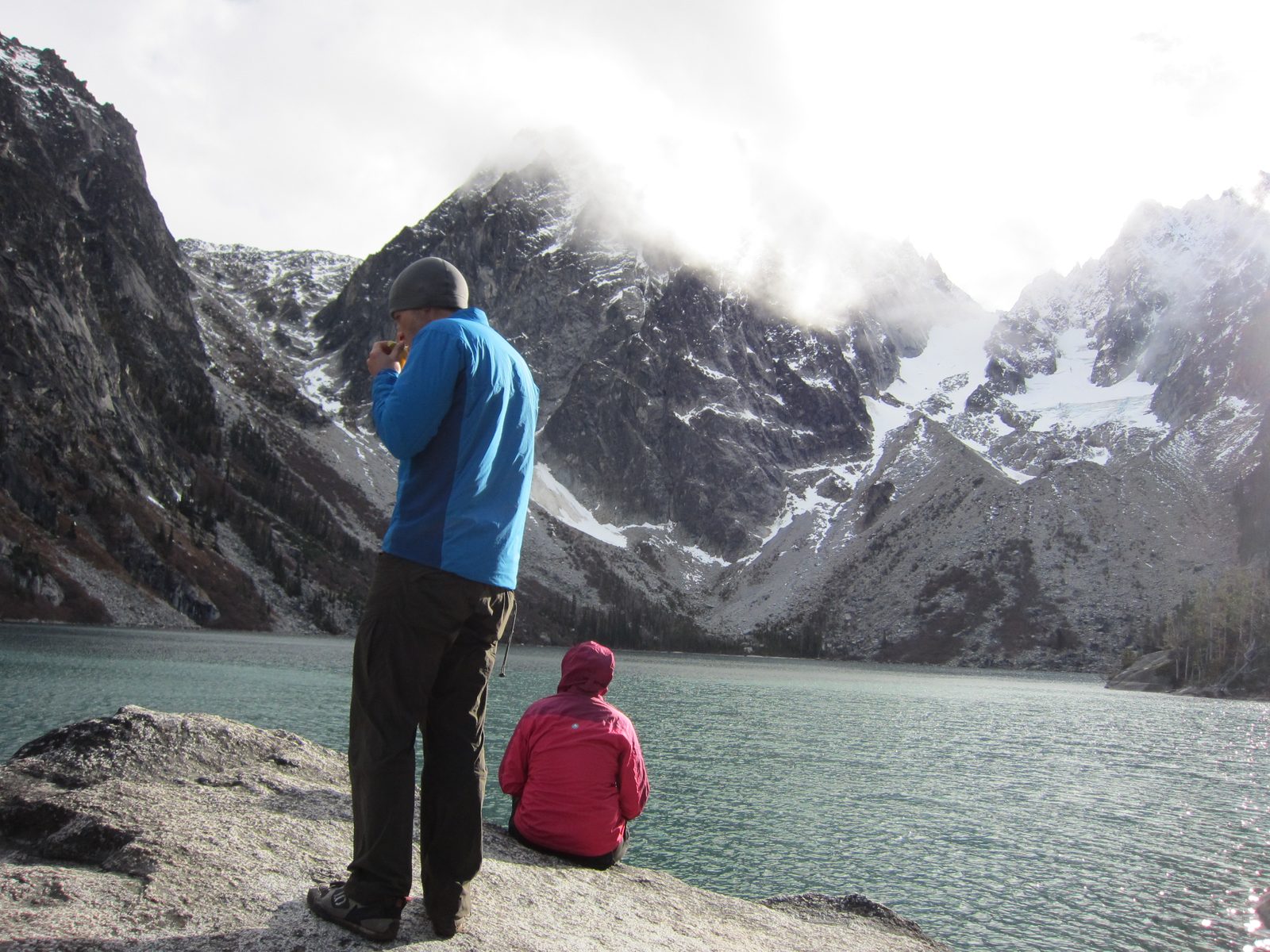 Jay eats and Catherine rests at Colchuck Lake (elevation: 5570 ft).