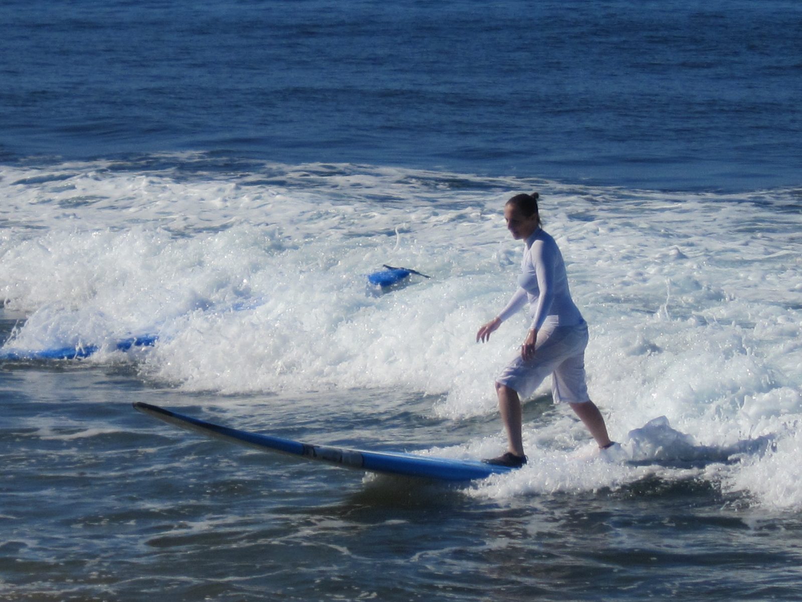 Proof that even small waves aren't simple: that's a riderless board on the left...