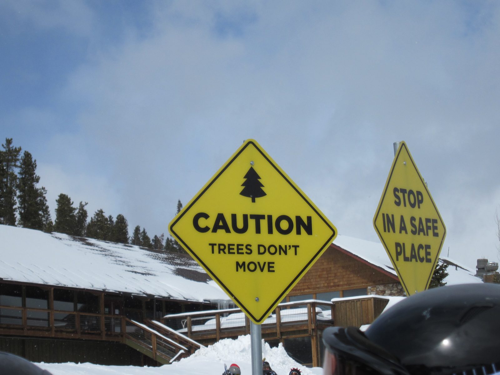 Big, yellow, humorous signs are all the rage, apparently.  This one was at a chairlift, but they...
