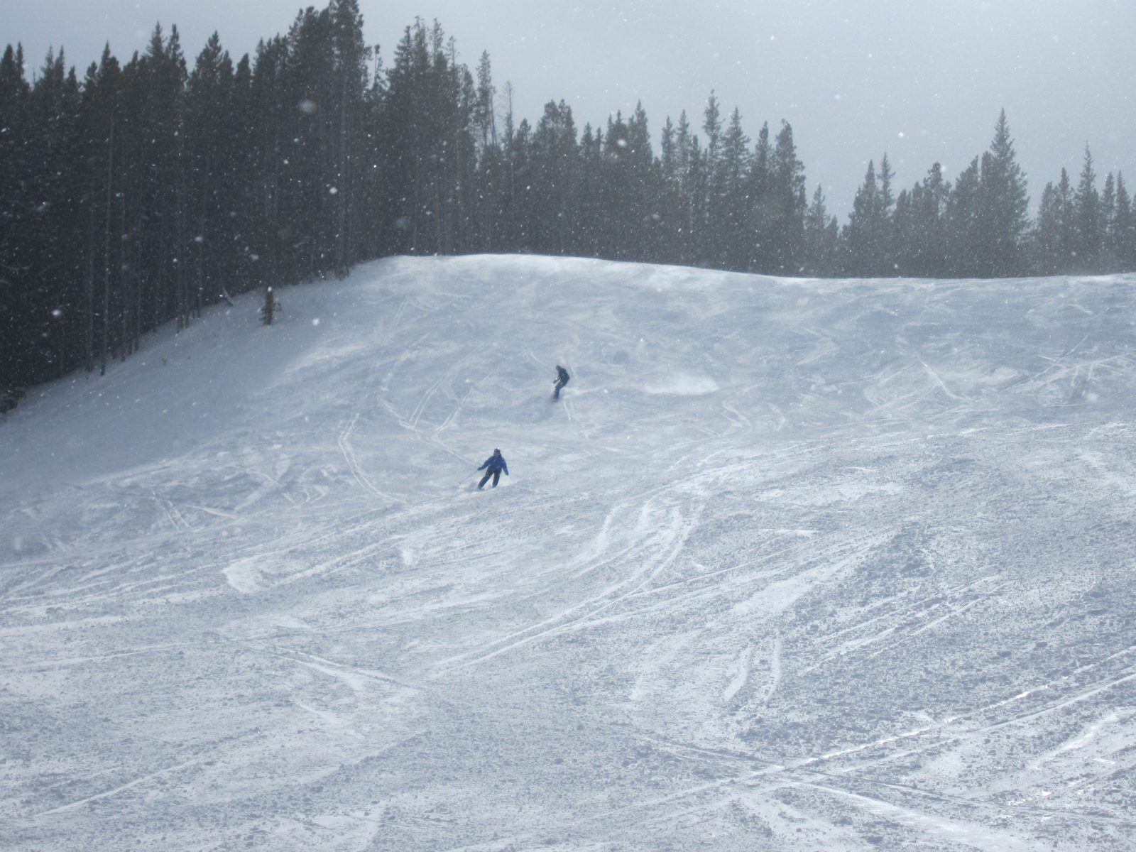 Catherine boards down a wide run at Breckenridge (I'm the one in back).