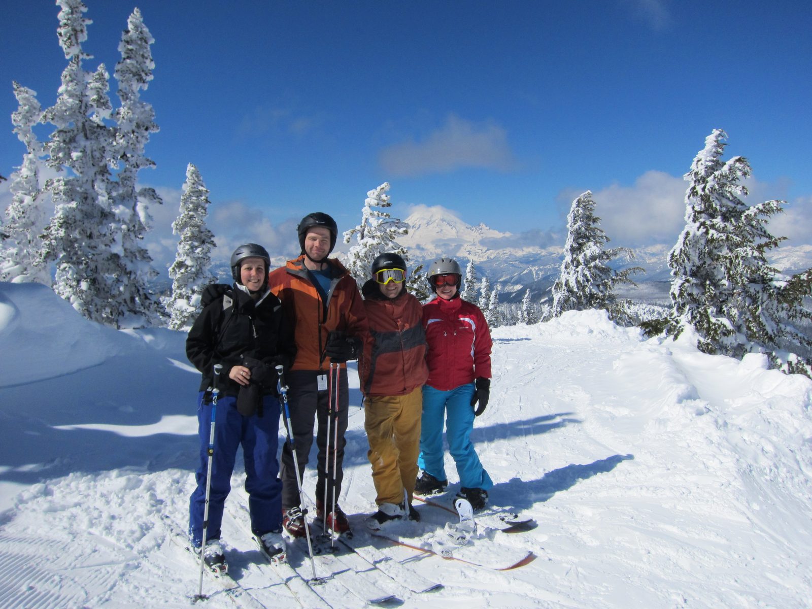 Group shot!  Catherine, Josh, John, and Diana at the top of the Couloir Express, with Mt Rainier behind.
