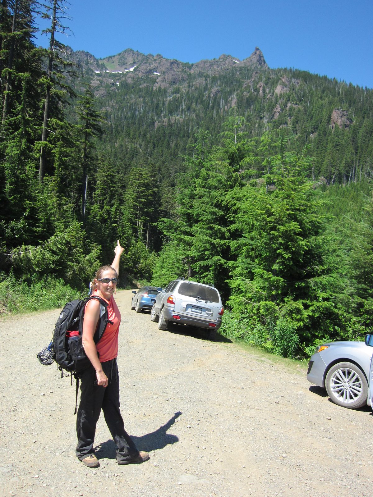 Pointing at where we'd been.  The top of the mountain is behind the visible ridge, but the...