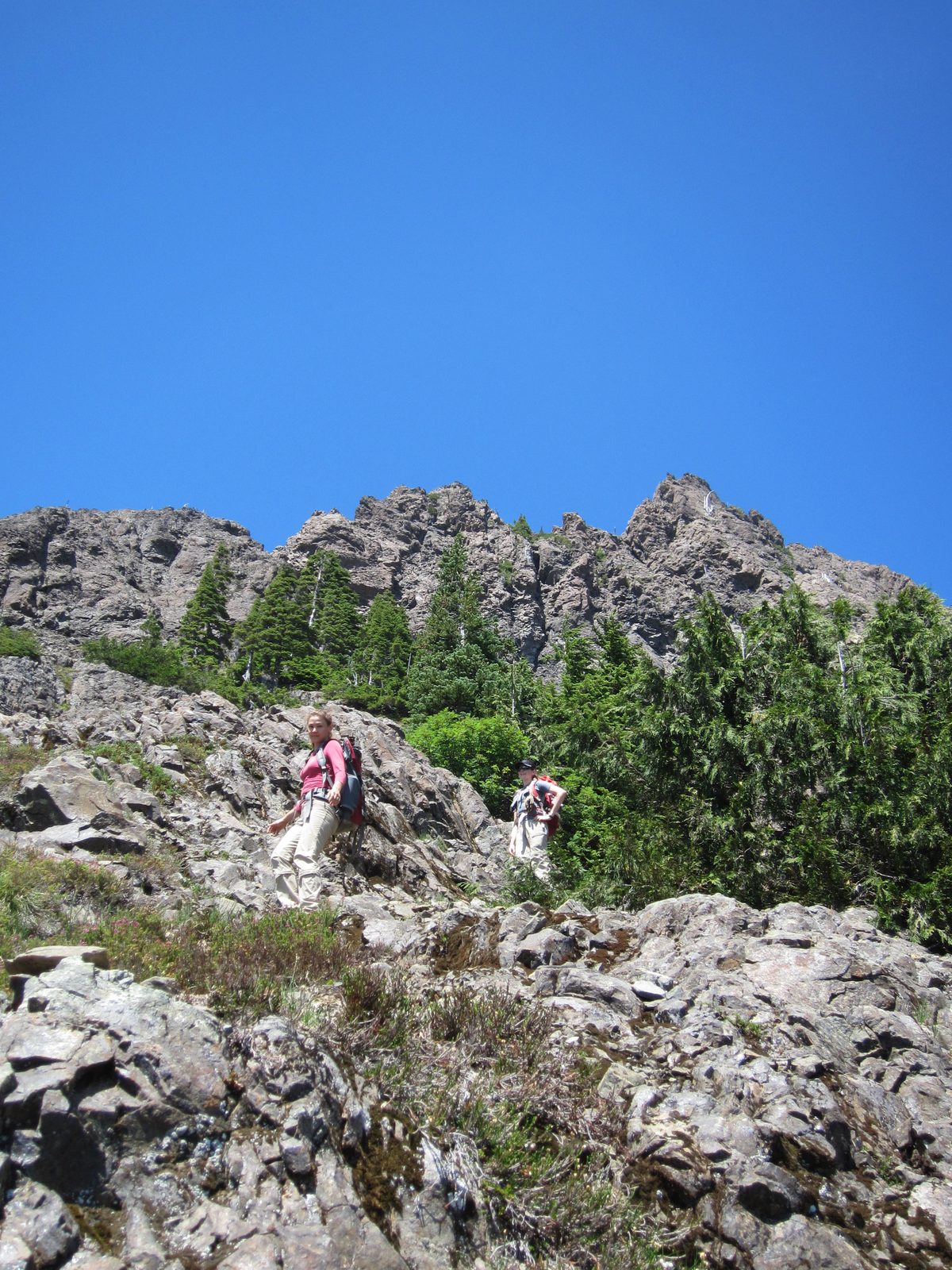 Funny pair of photos - hiking down rocks...