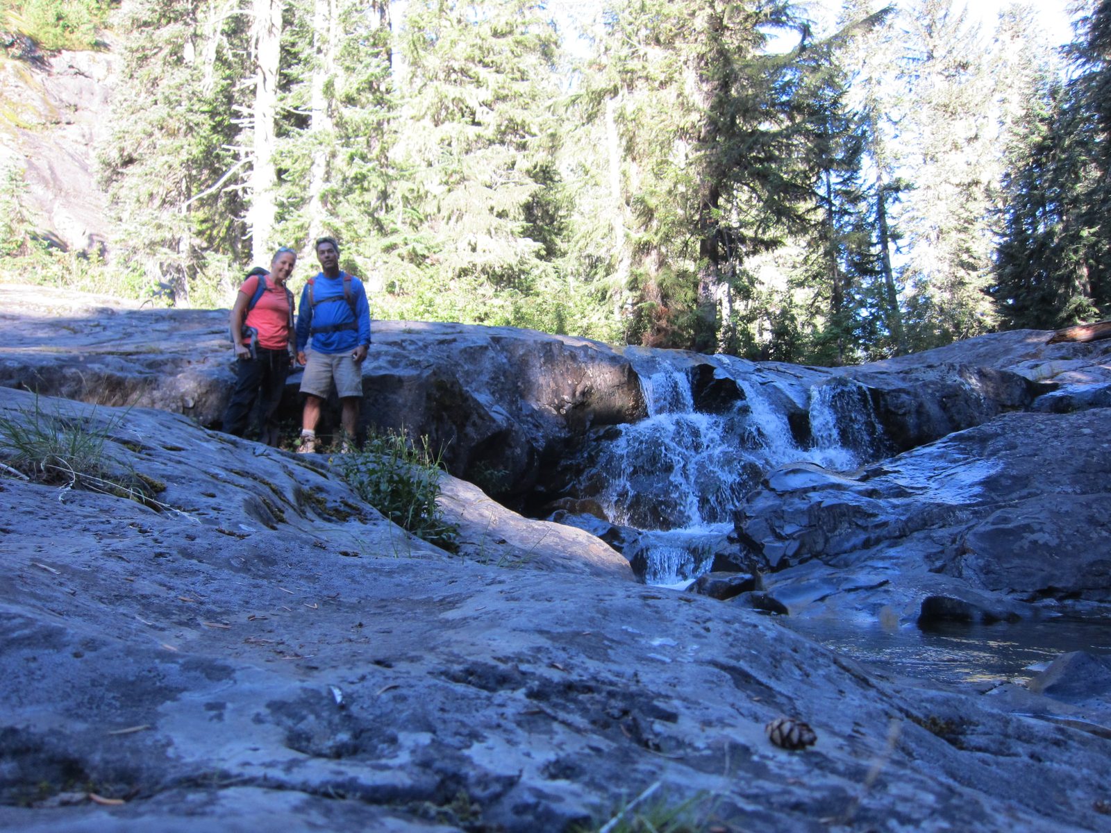 Using the timer function to get a photo with a waterfall next to the trail.
