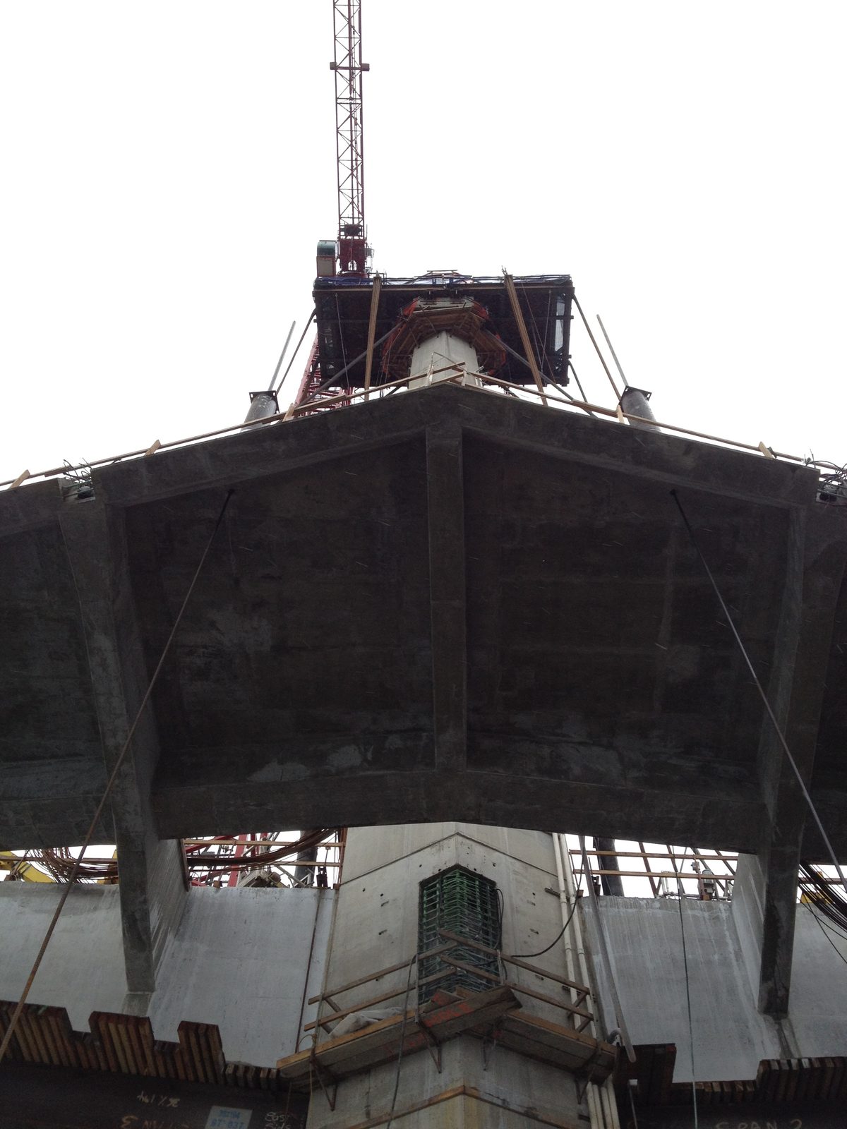 Looking up at the bottom of the sidewalk as it skirts around Tower 3.