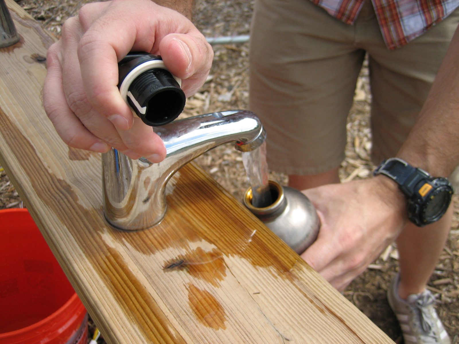 Closer view of the faucet setup.